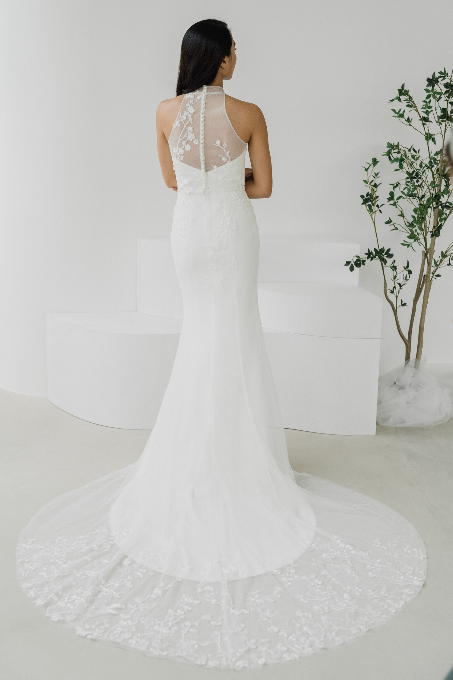 Sarah bridal cheongsam back view with delicate lace overlay