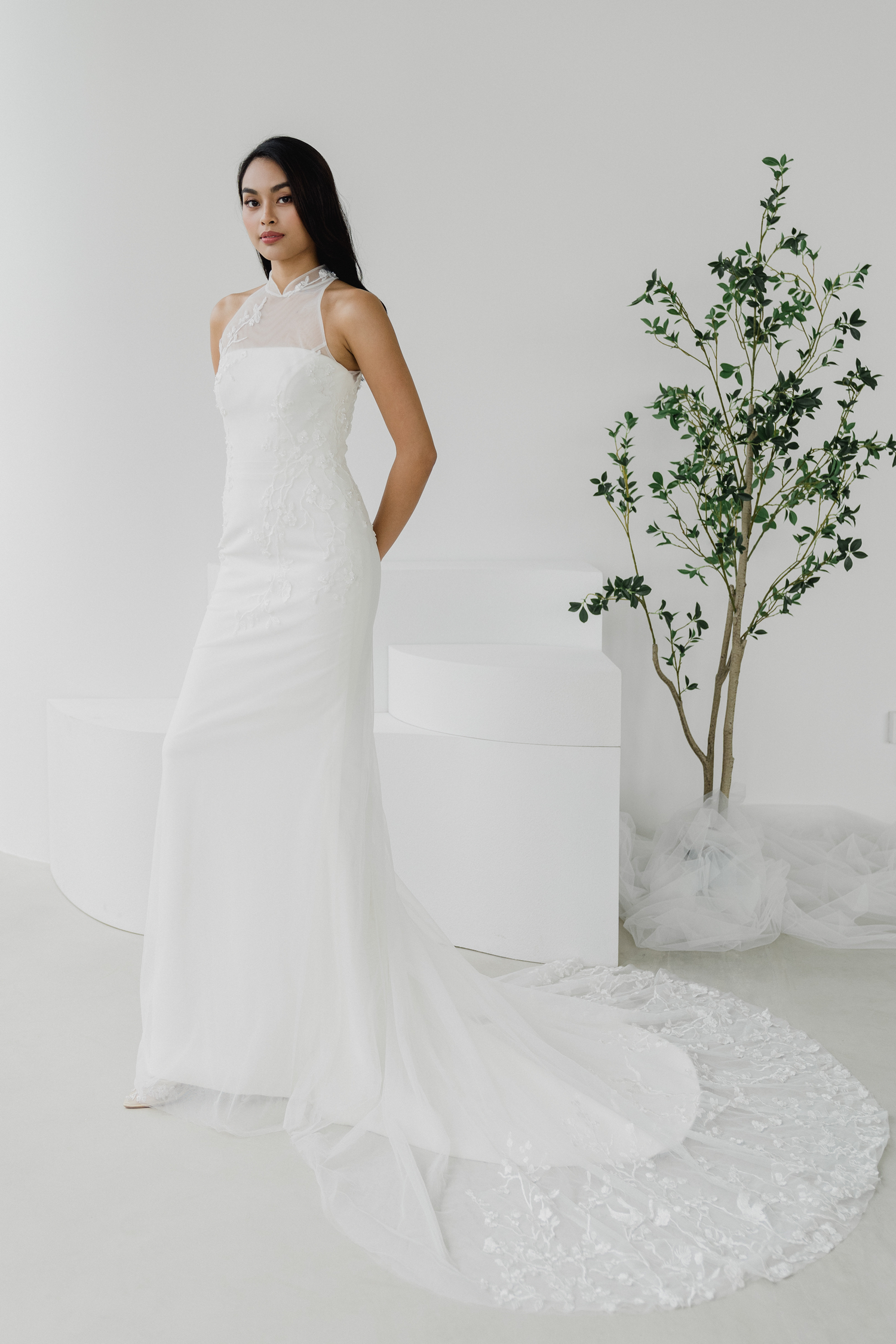 Sarah bridal cheongsam featuring a removable lace and tulle overlay