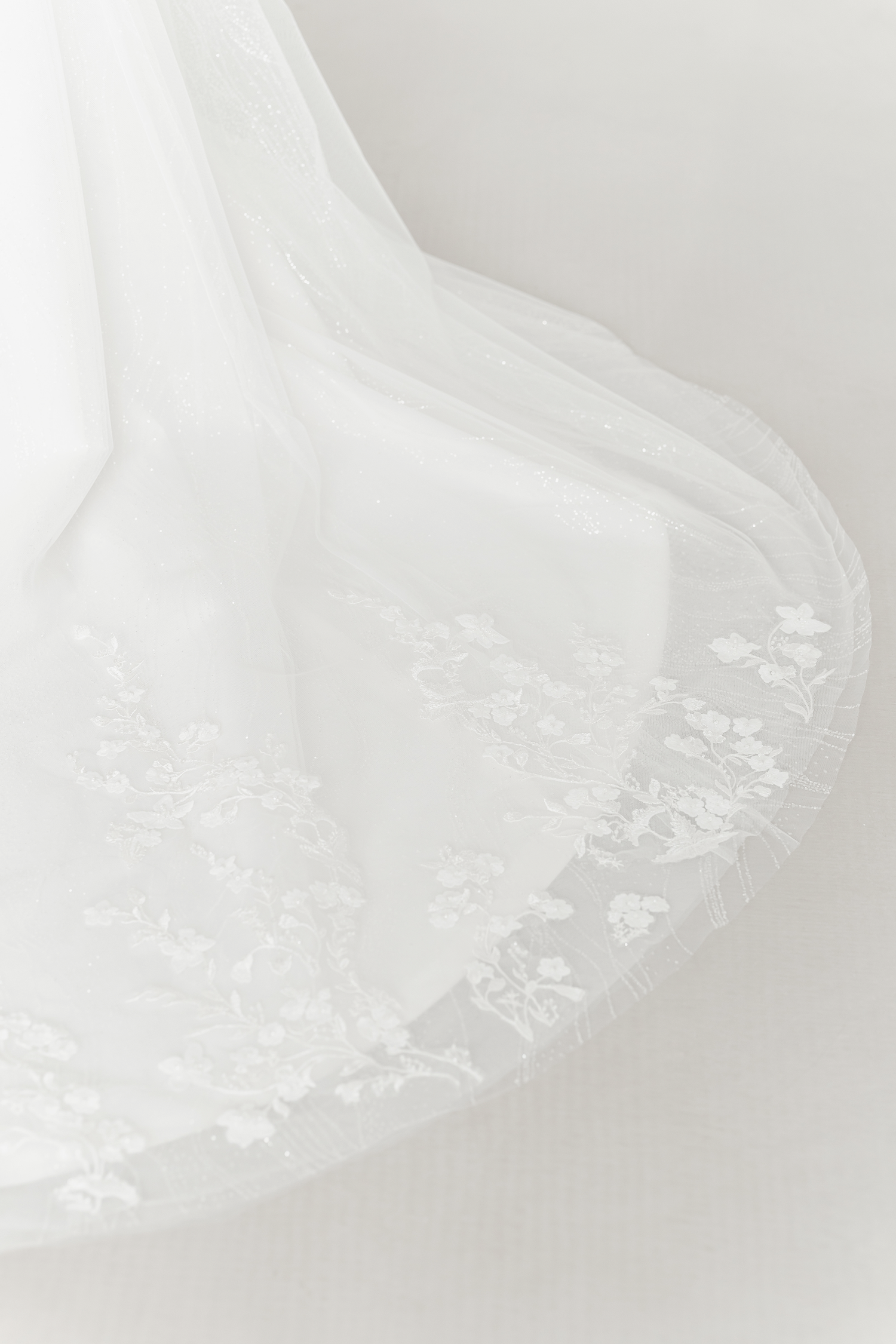 Close-up of Shanice wedding dress with delicate floral lace appliqués