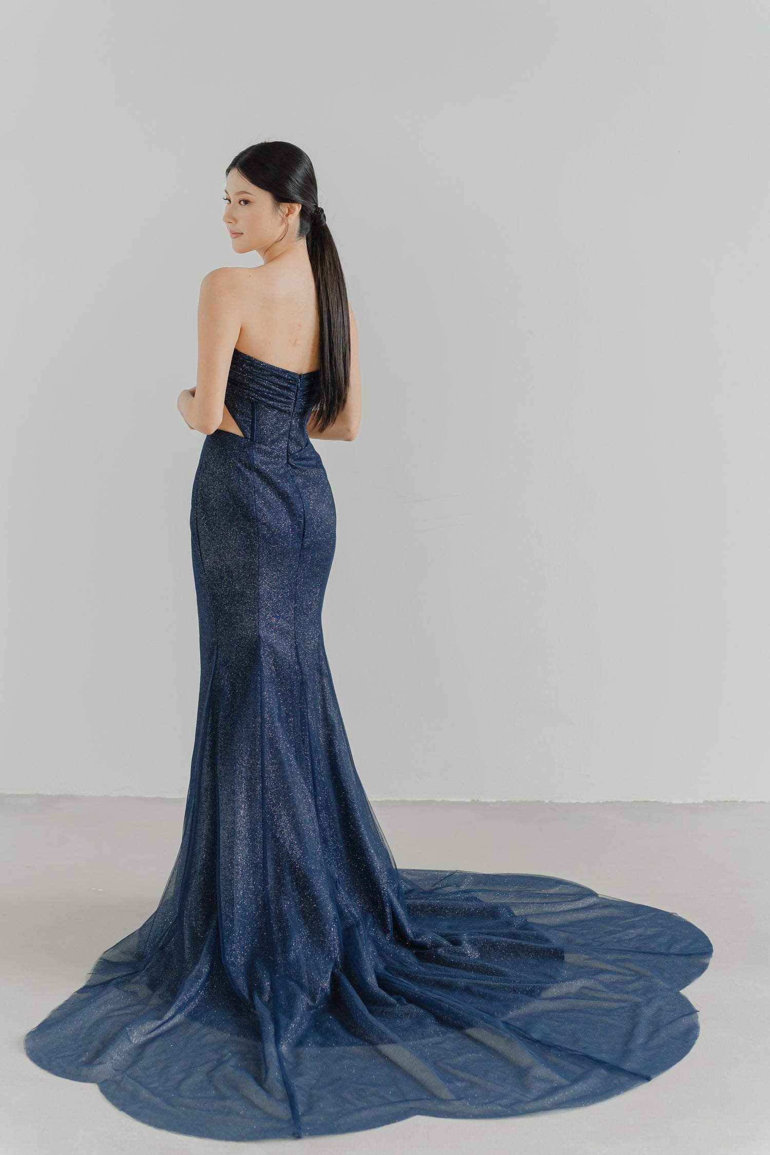 Solenne evening dress back view with an elegant fitted silhouette