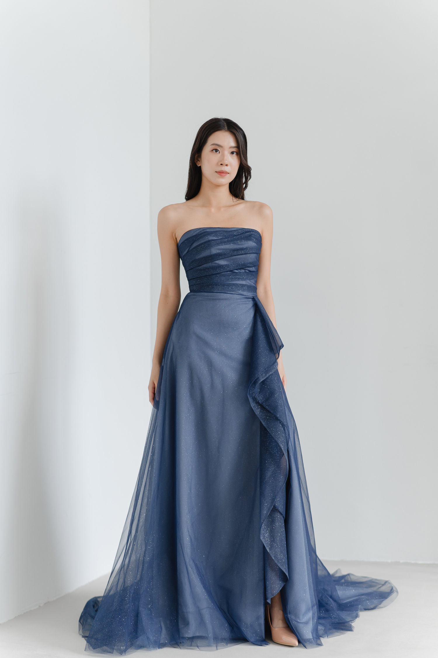 Sylvie evening dress featuring cascading front ruffles and subtle sparkle