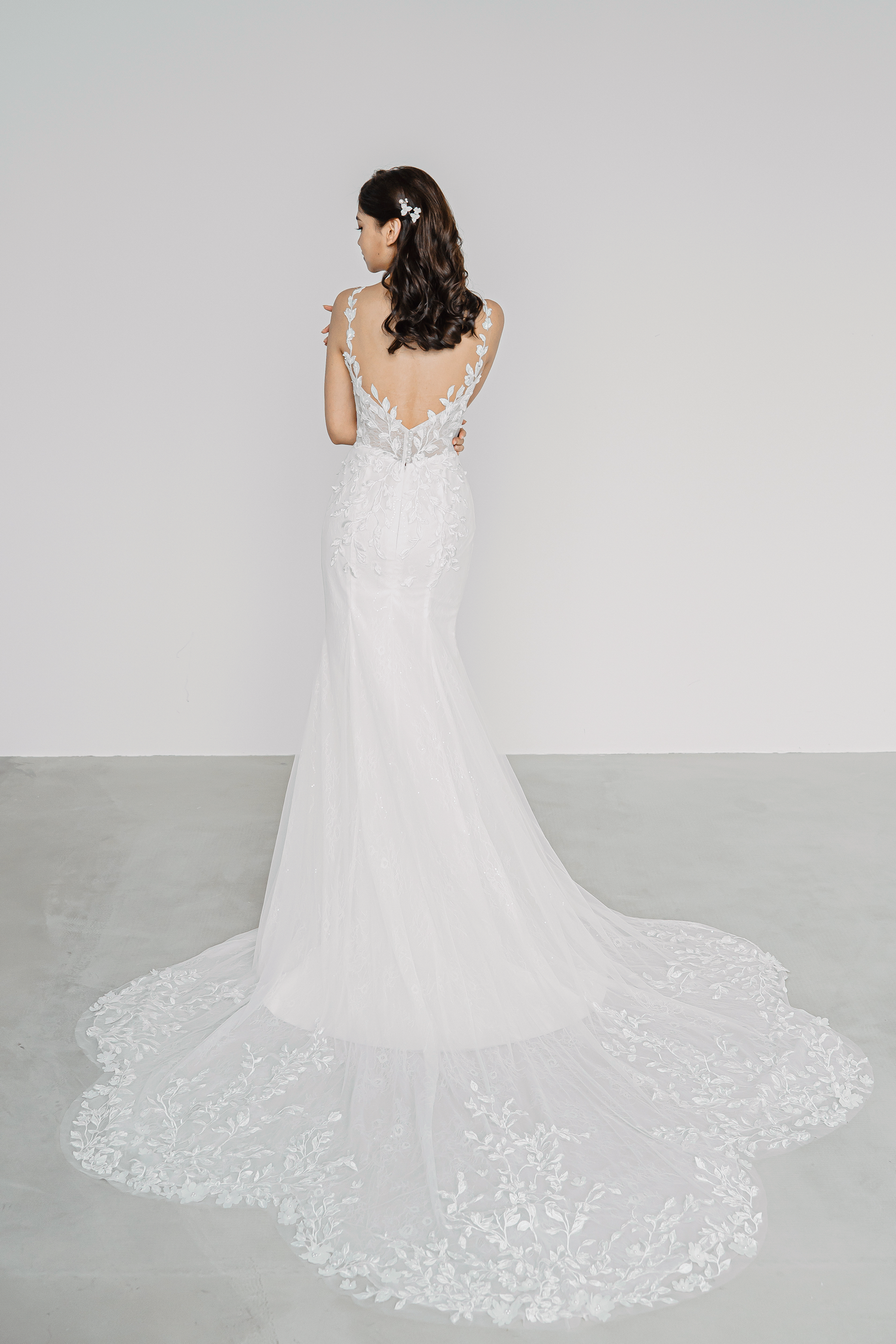 Tricia wedding dress featuring a delicate petal-shaped train