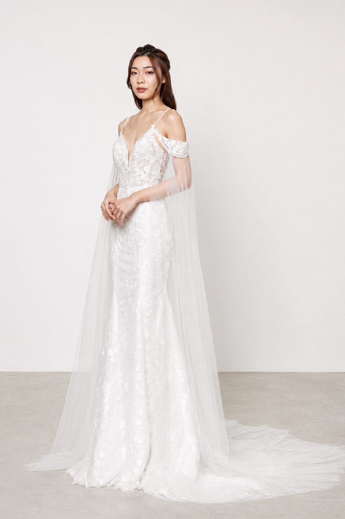 Veronica bridal gown featuring intricate floral lace and a soft peach-toned lining