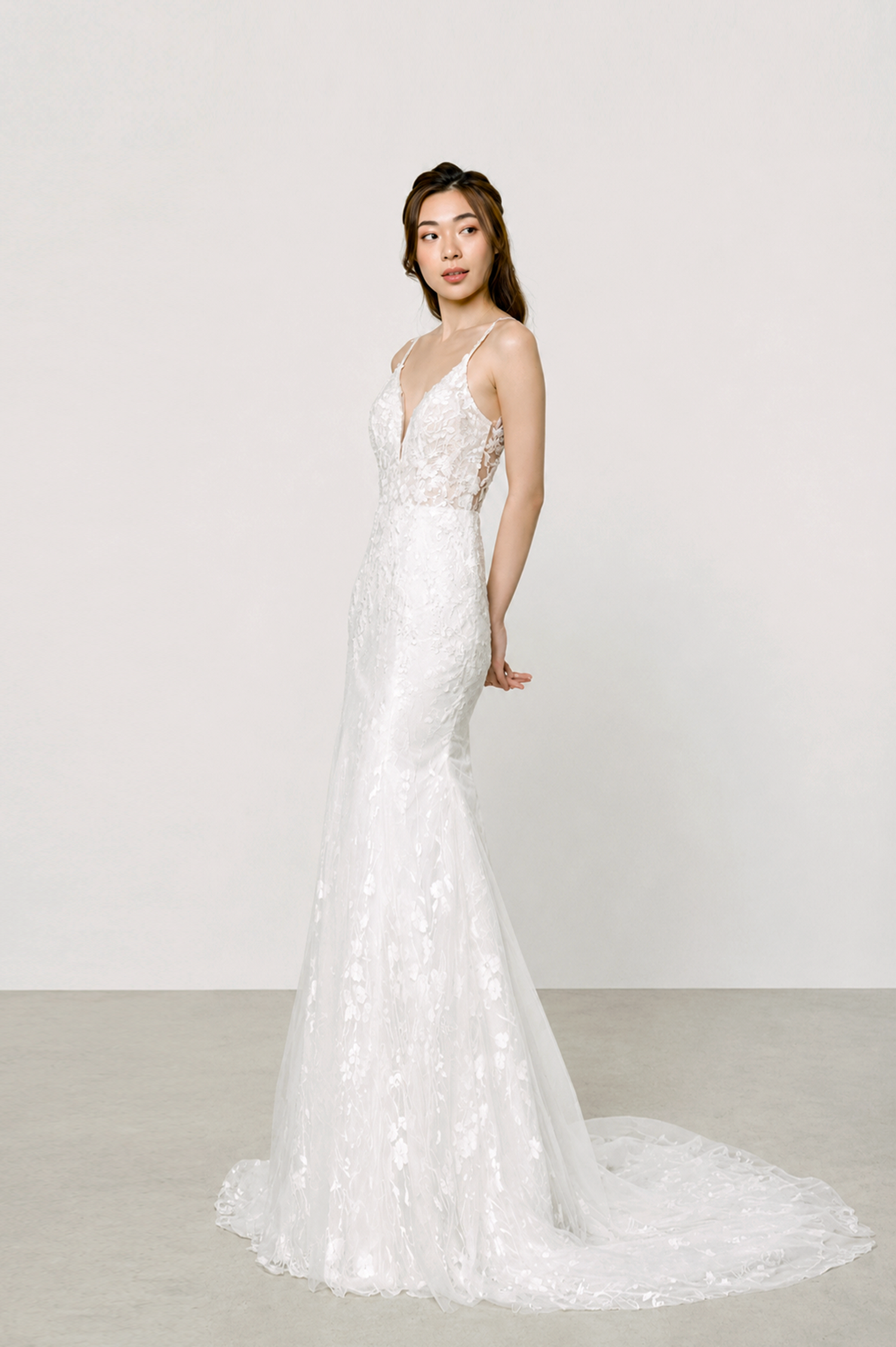 Veronica wedding dress front view with a V-neckline, spaghetti straps and full floral lace