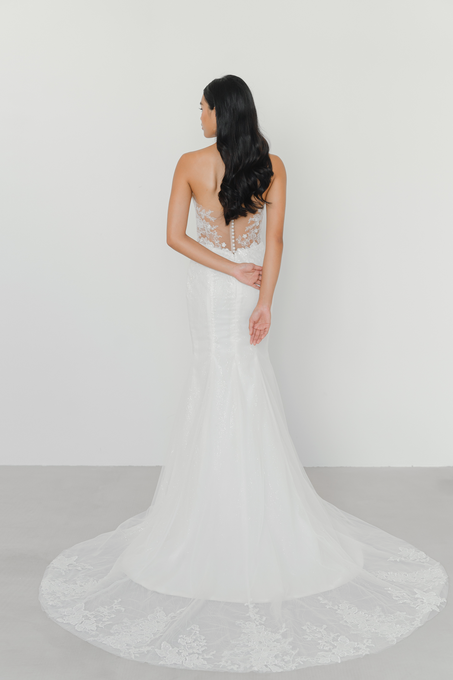 Vivian bridal gown train showcasing intricate lace edging and a romantic flowing train