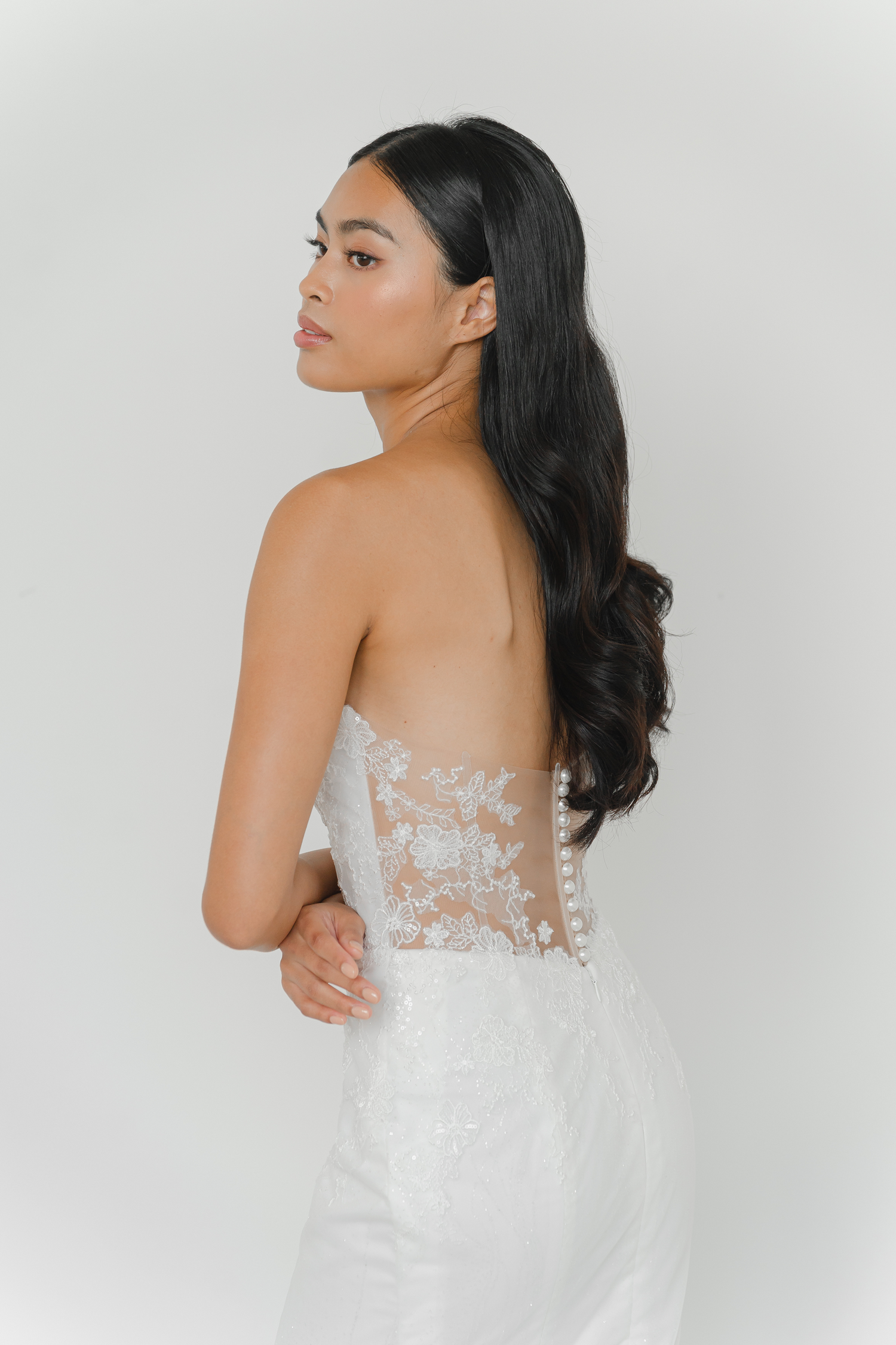 Close-up of Vivian wedding dress with delicate floral lace detailing