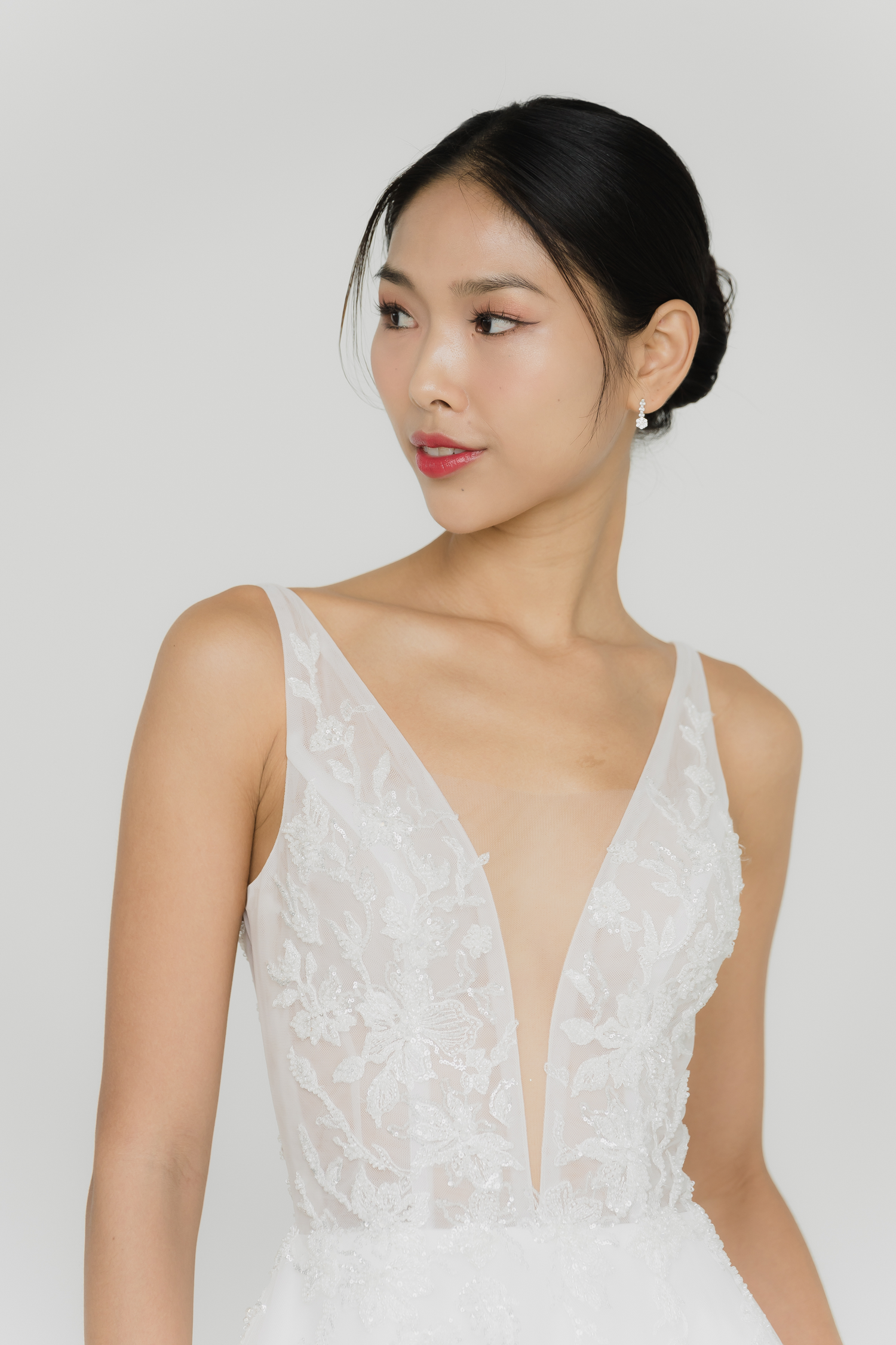 Close-up of Willow bridal gown showcasing the deep V-plunge neckline