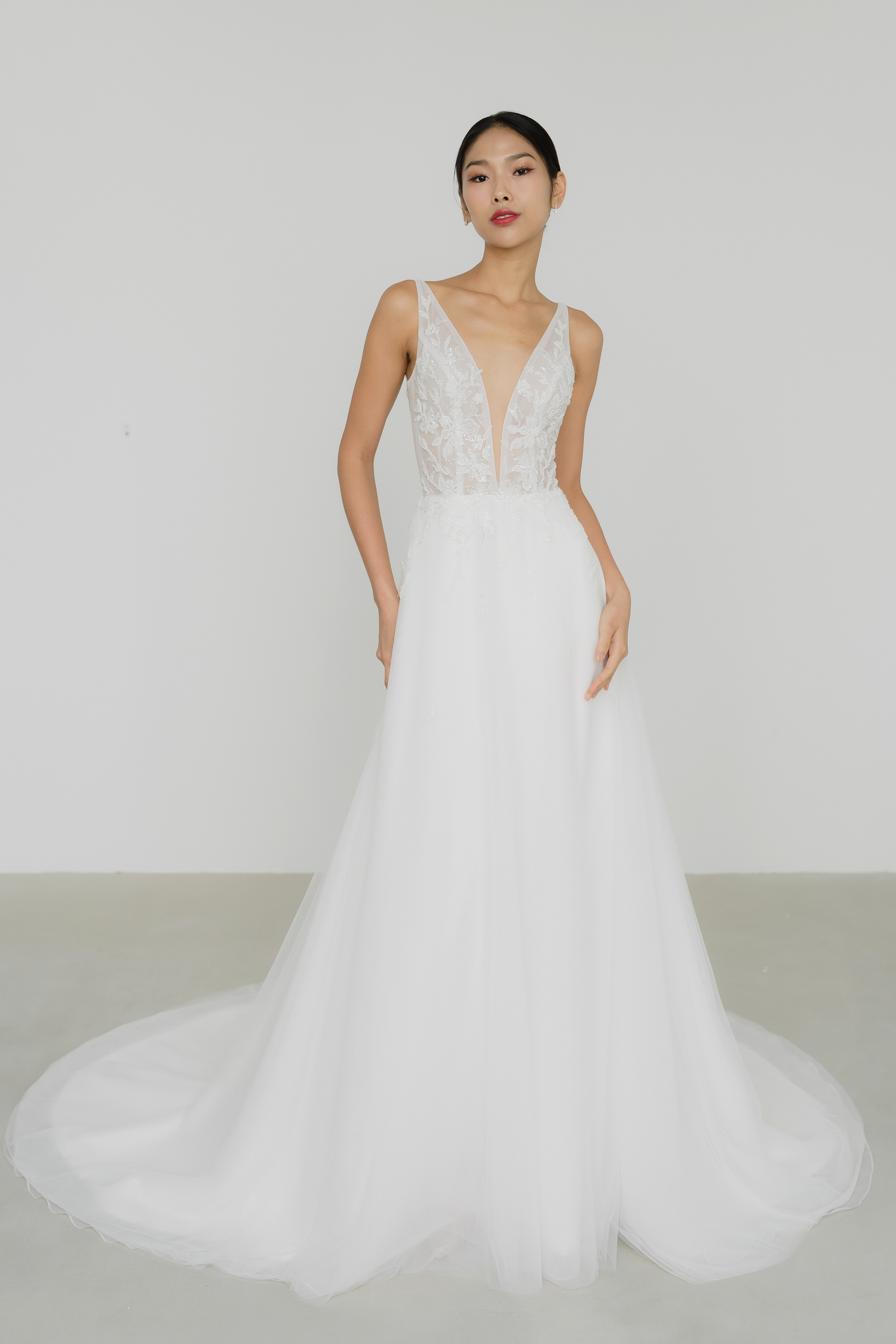 Willow wedding dress front view with a deep V-plunge neckline and classic A-line silhouette