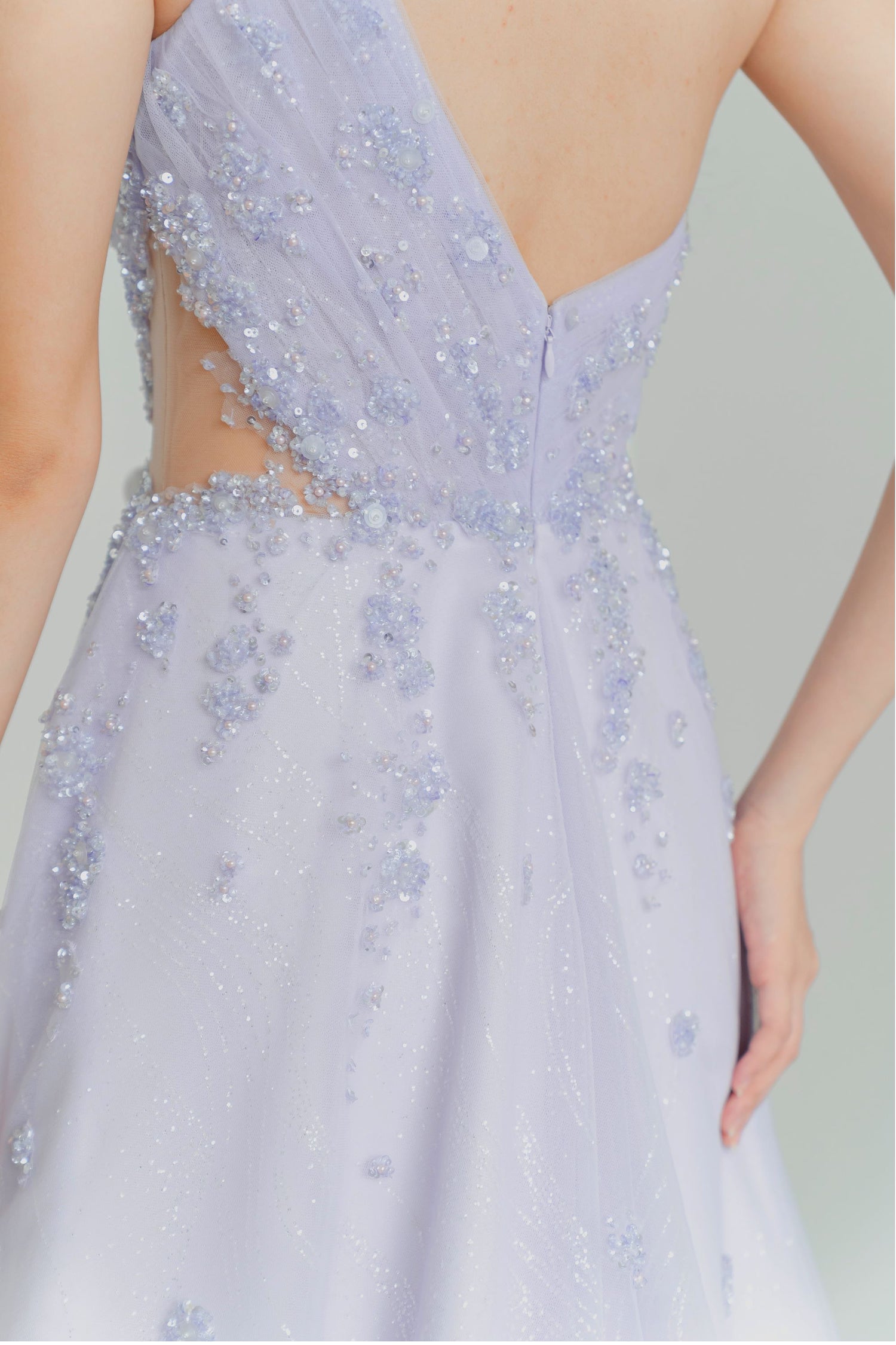 Close-up of Wisteria evening dress highlighting the intricate beadwork and sequins