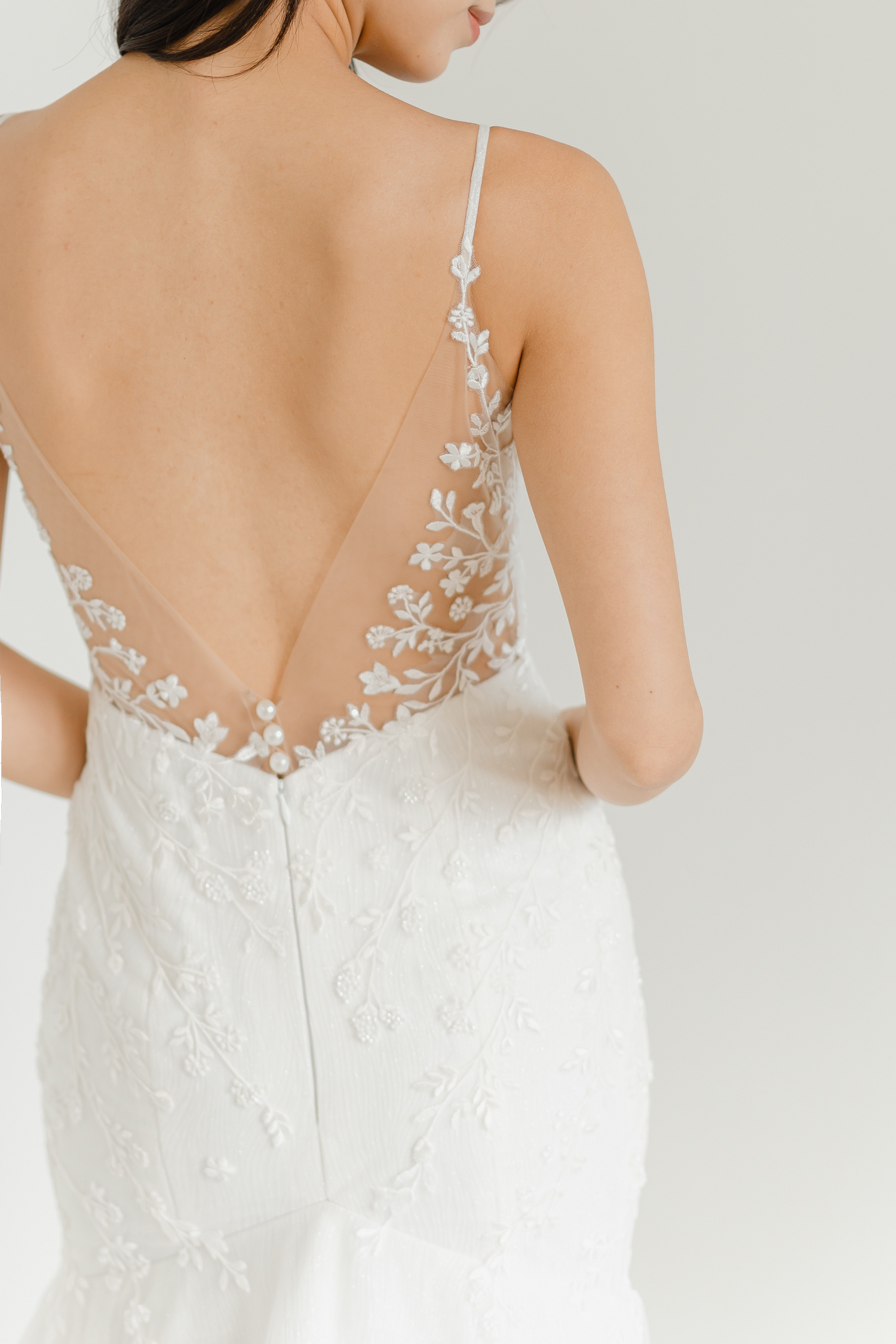 Close-up of Yvonne wedding dress with delicate wildflower lace detailing
