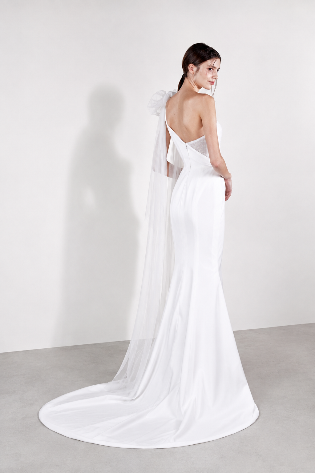 Chelsea wedding gown side view showcasing the detachable soft tulle bow