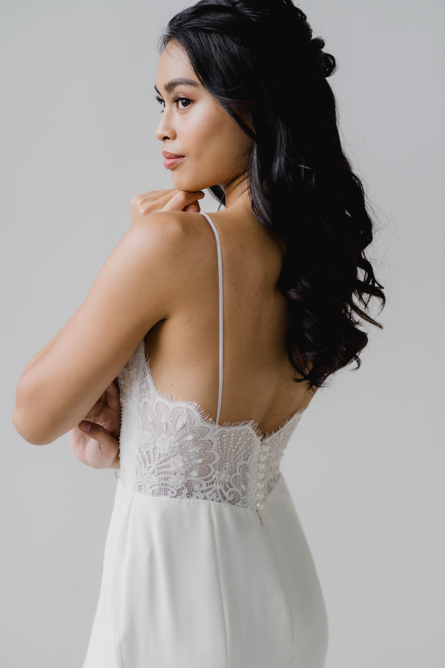Adele wedding dress side view with slender spaghetti straps
