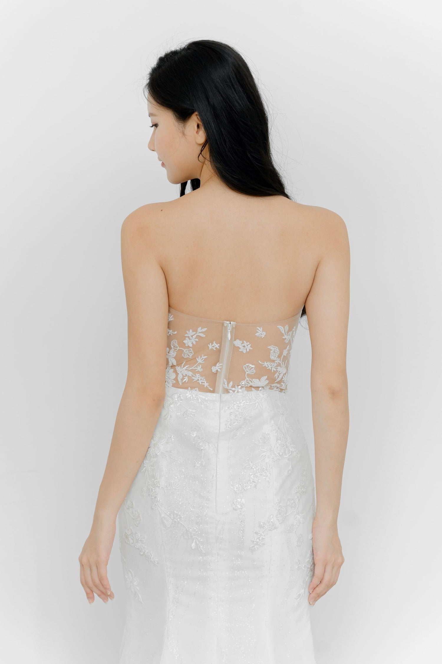 Close-up of Alethea wedding dress highlighting the intricate beaded lace detailing