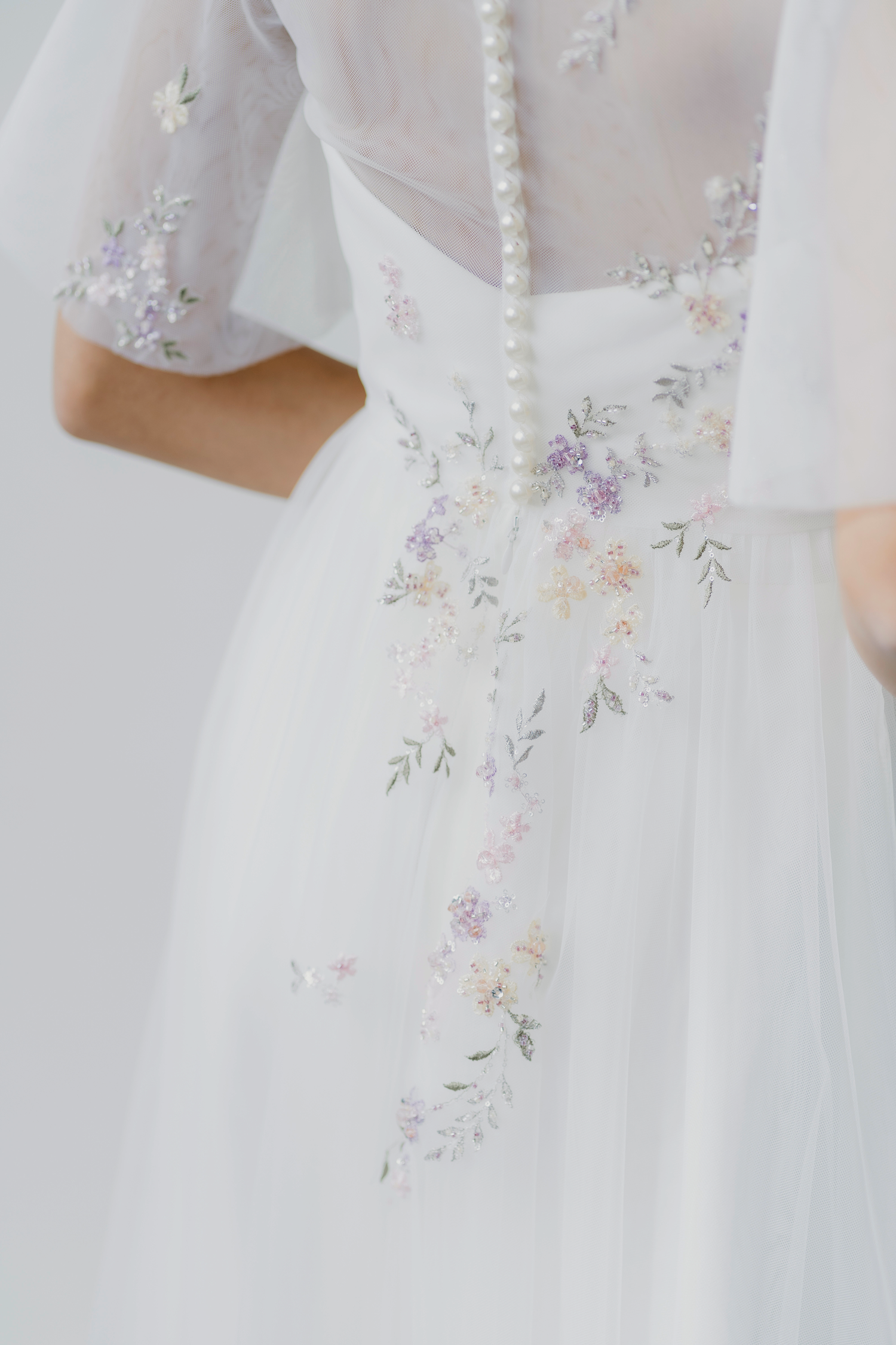 Close-up of Angeline wedding cheongsam with pastel beaded florals