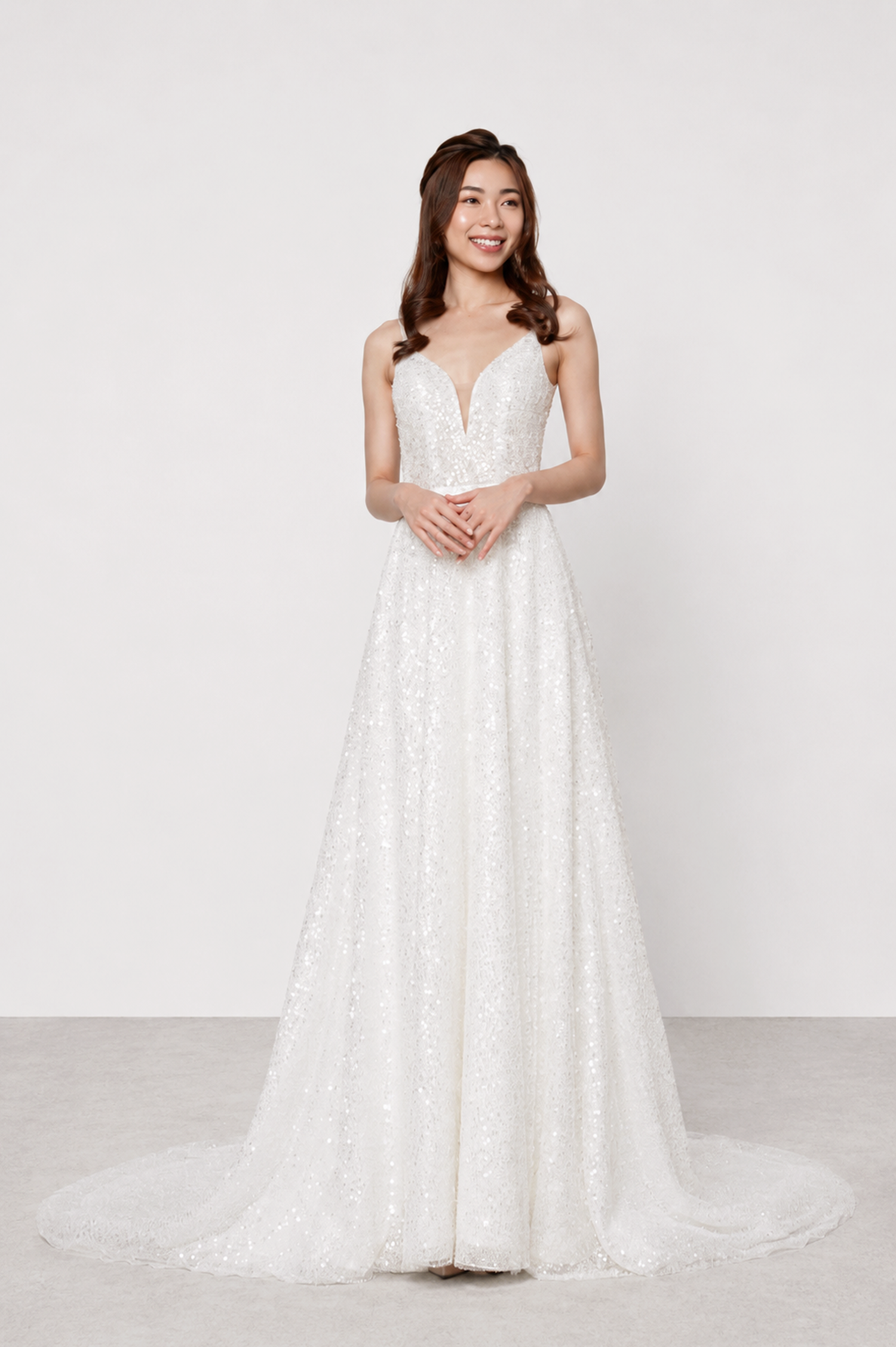 Anna wedding dress front view with a plunging V-neckline and shimmering sequined A-line silhouette