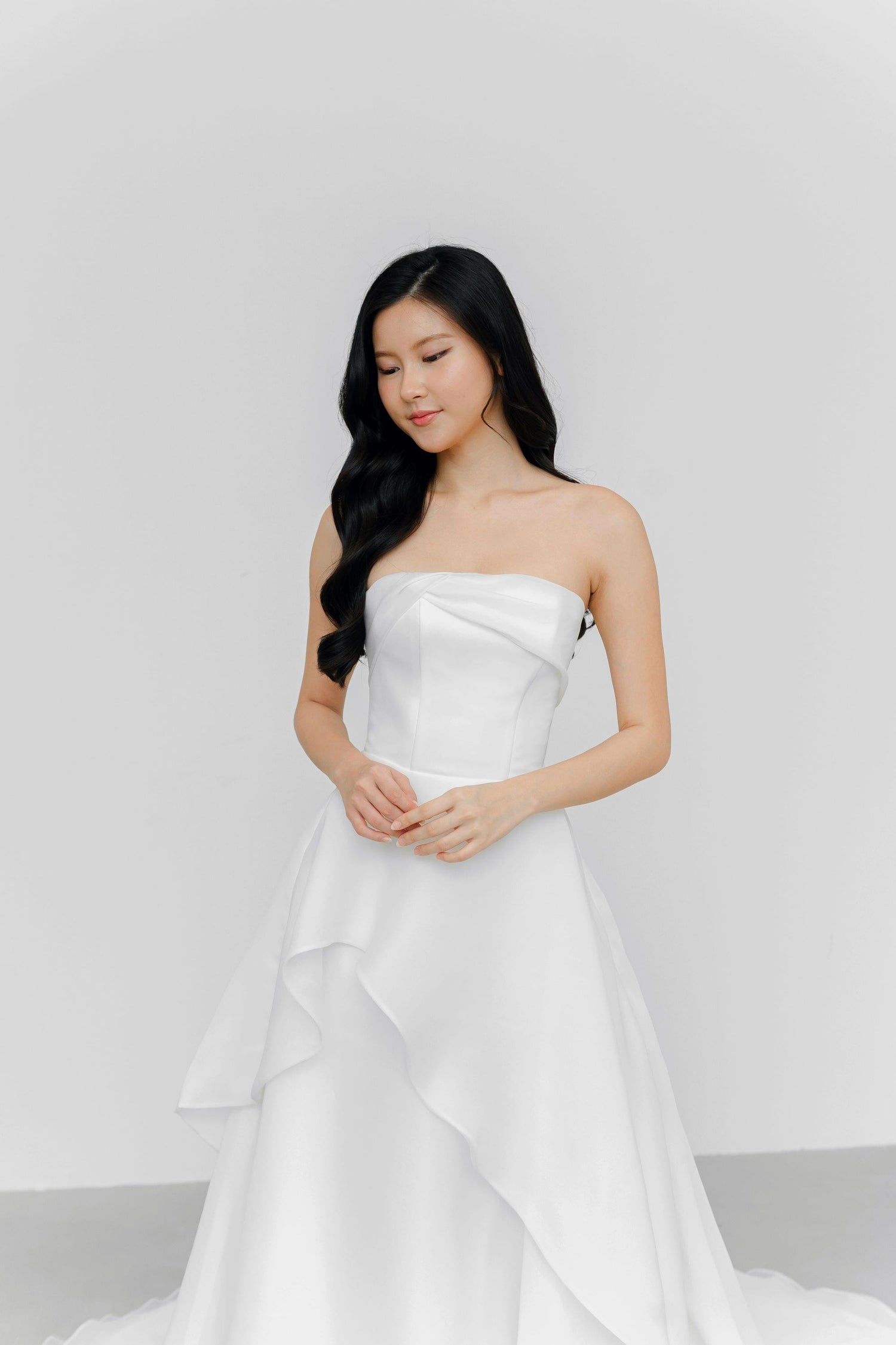Arabelle bridal gown featuring soft organza ruffles and a minimalist silhouette