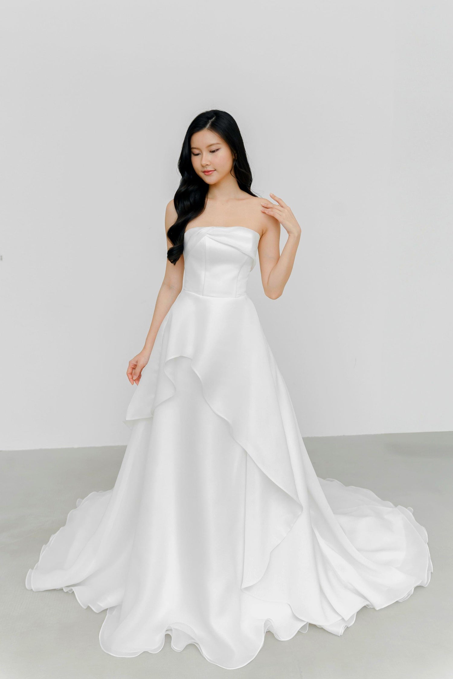 Arabelle wedding dress front view with a strapless neckline and airy organza silhouette