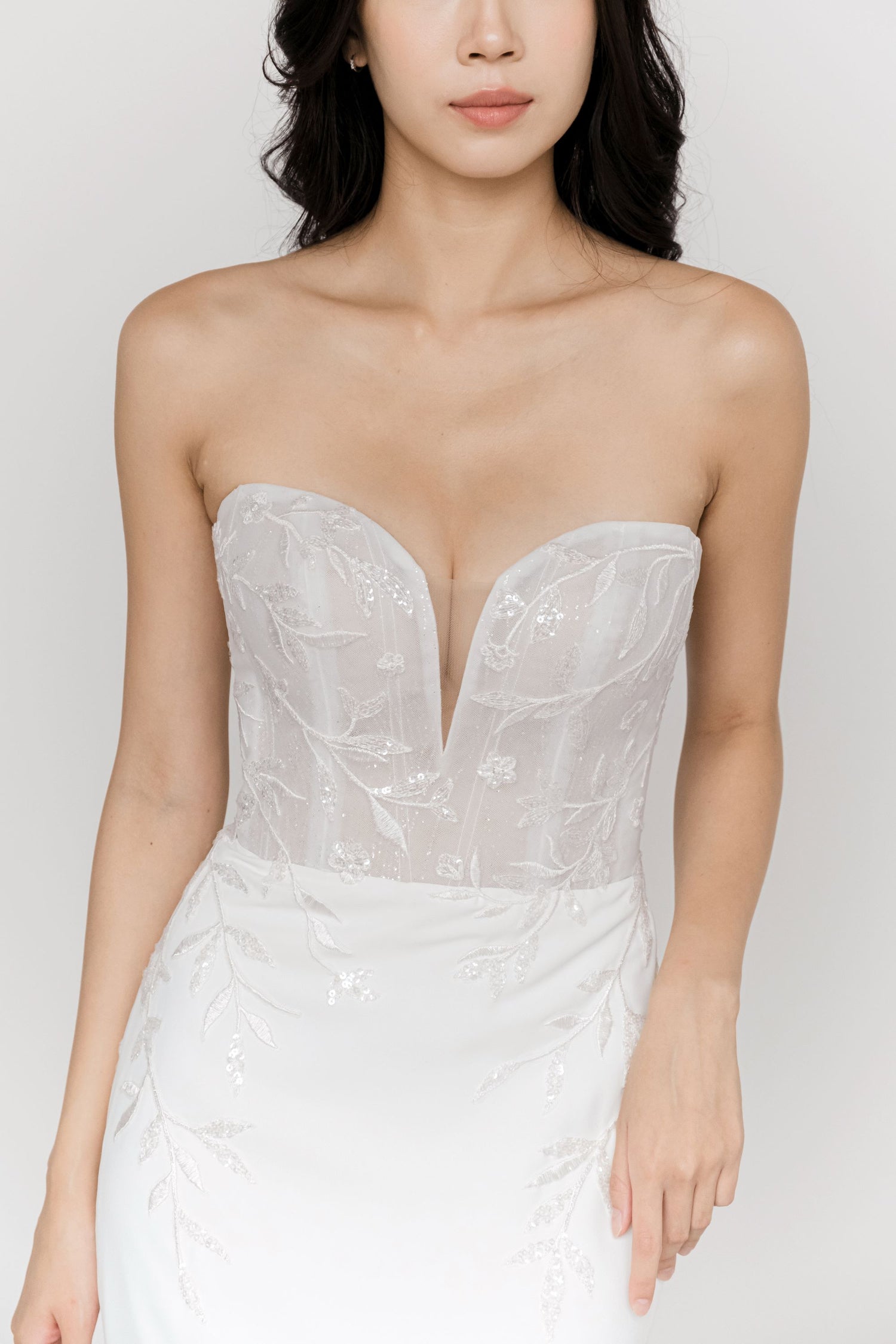 Aria wedding dress front view with a strapless sweetheart neckline and botanical lace