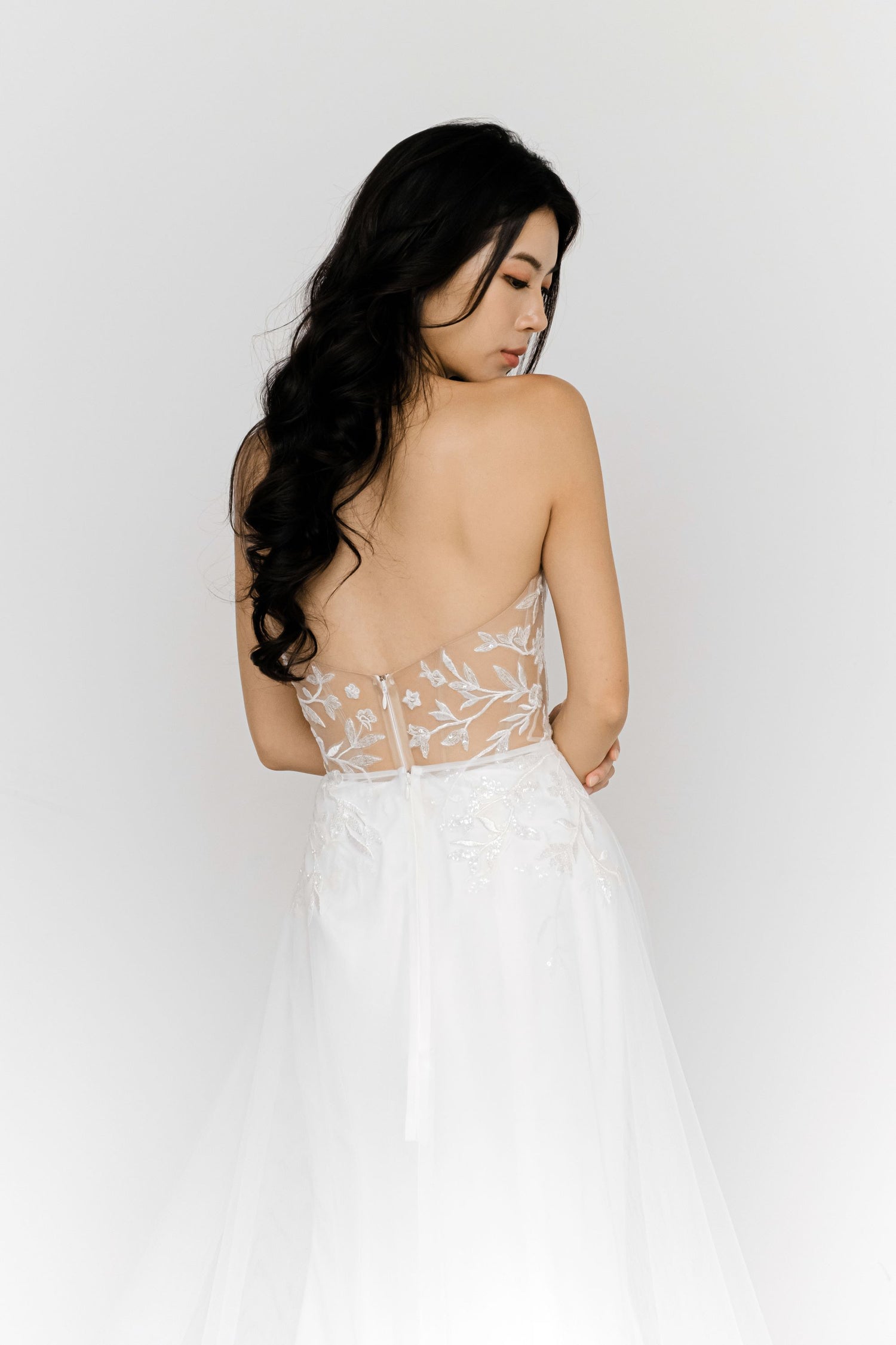 Aria wedding gown side view showcasing the elegant mermaid silhouette