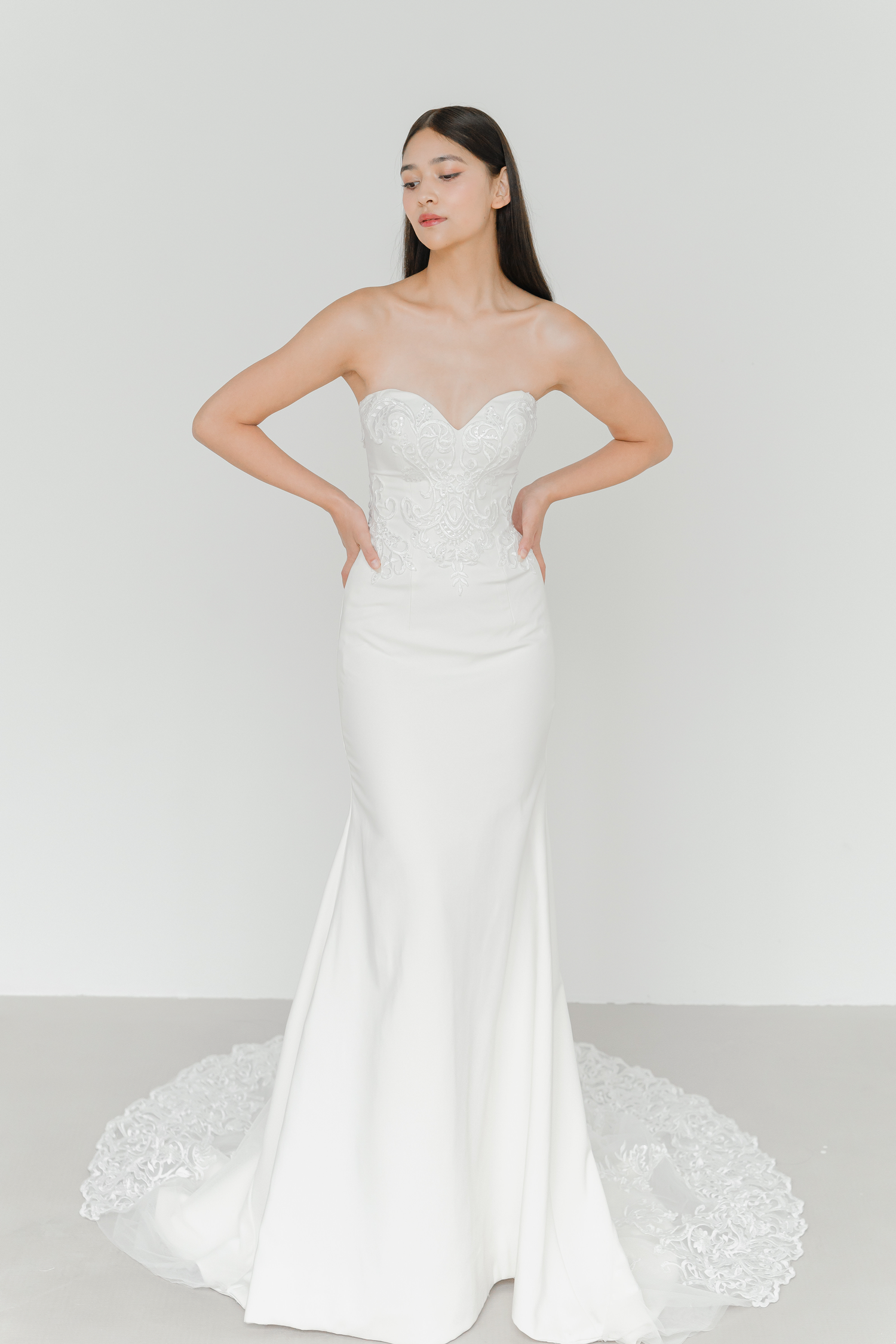 Audrey wedding dress featuring delicate lace and minimalist crepe