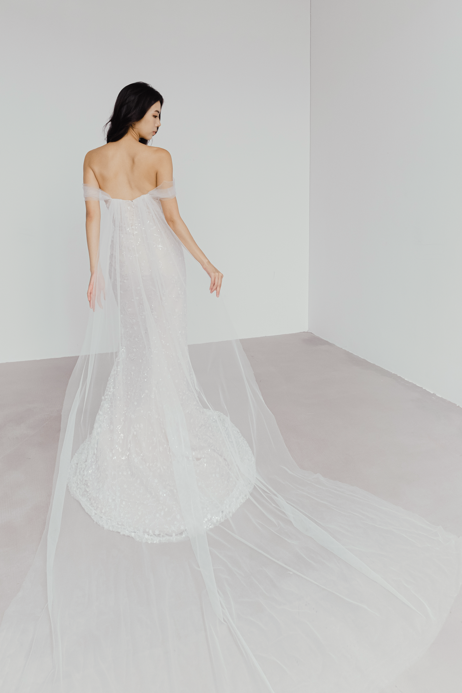 Aurelia wedding dress back view with the dramatic detachable tulle cape