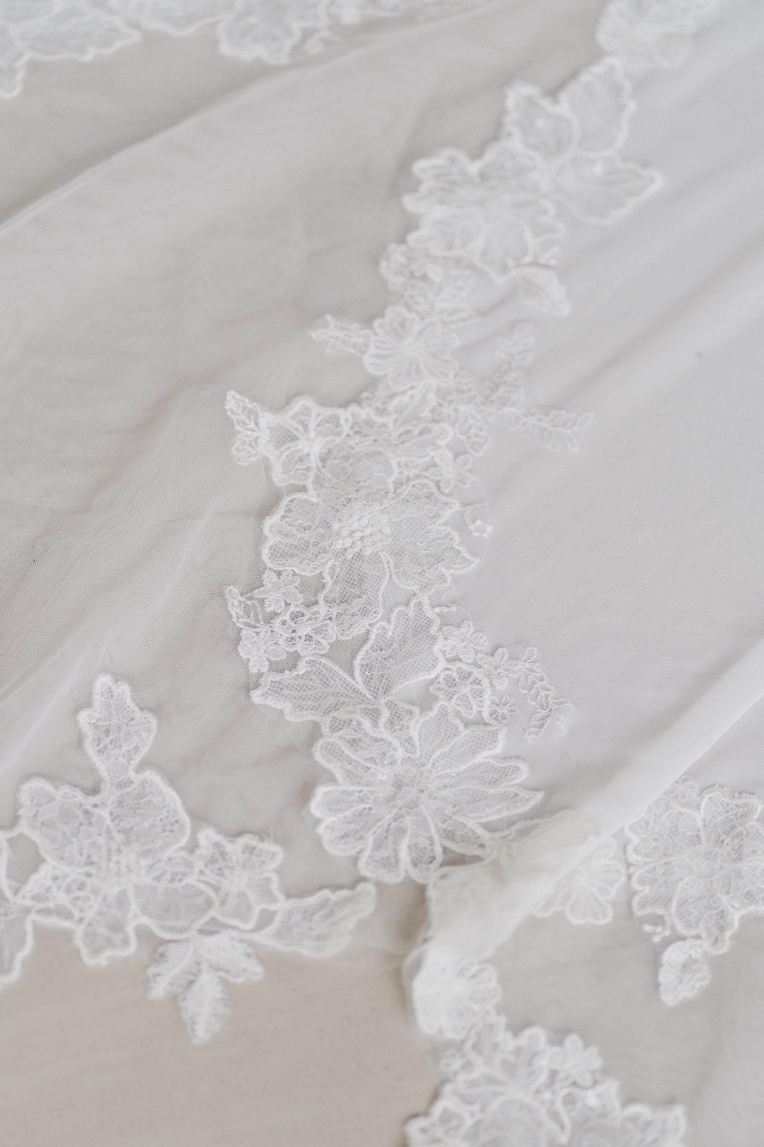 Aveline wedding dress featuring a petal-inspired scalloped lace train