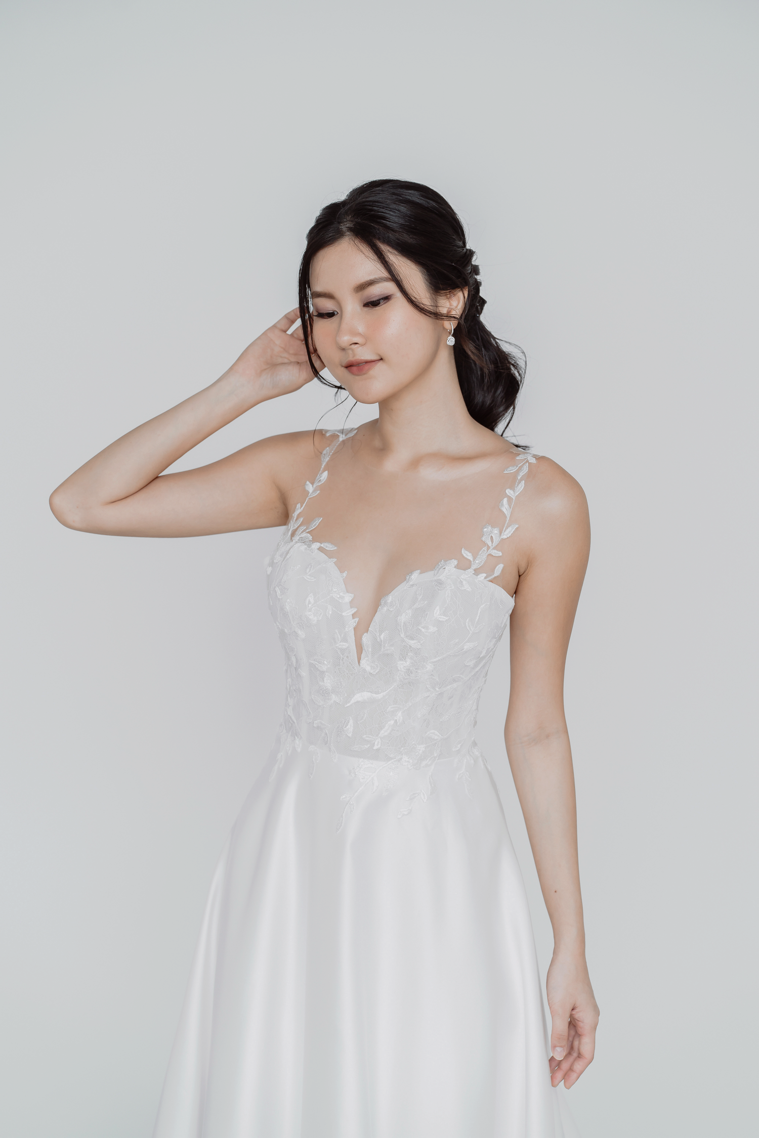 Bella bridal gown front view with a leafy lace illusion bodice