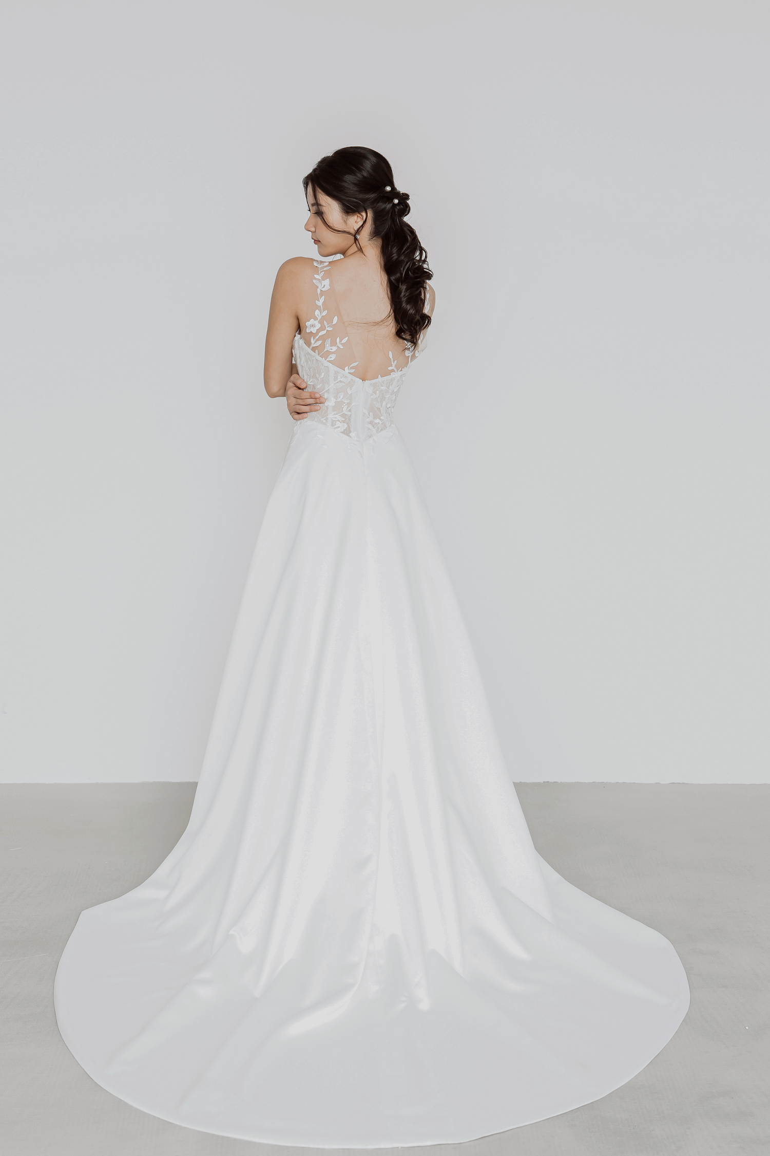 Bella bridal gown featuring a satin A-line train