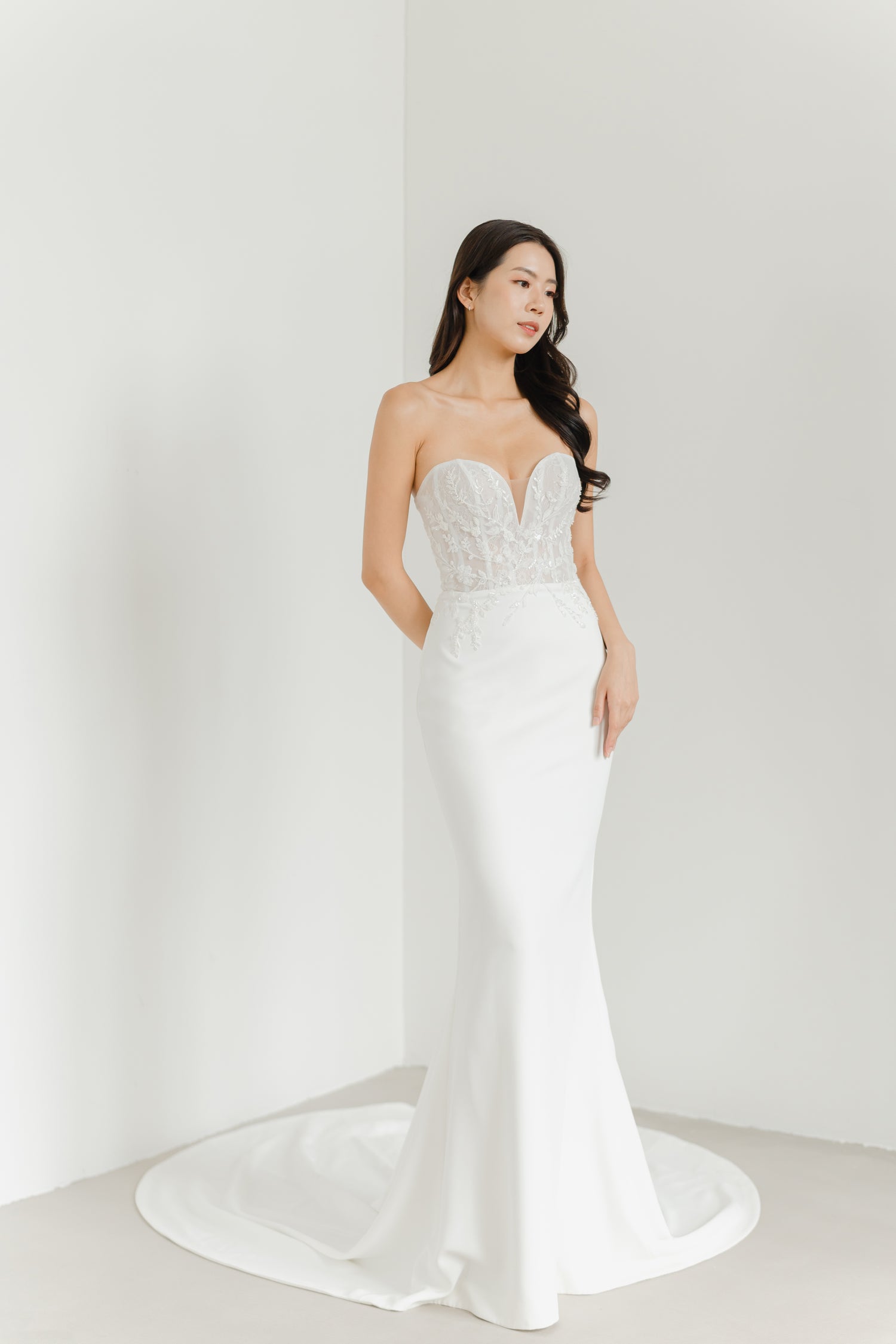 Benetta wedding dress featuring a structured lace and beaded bodice