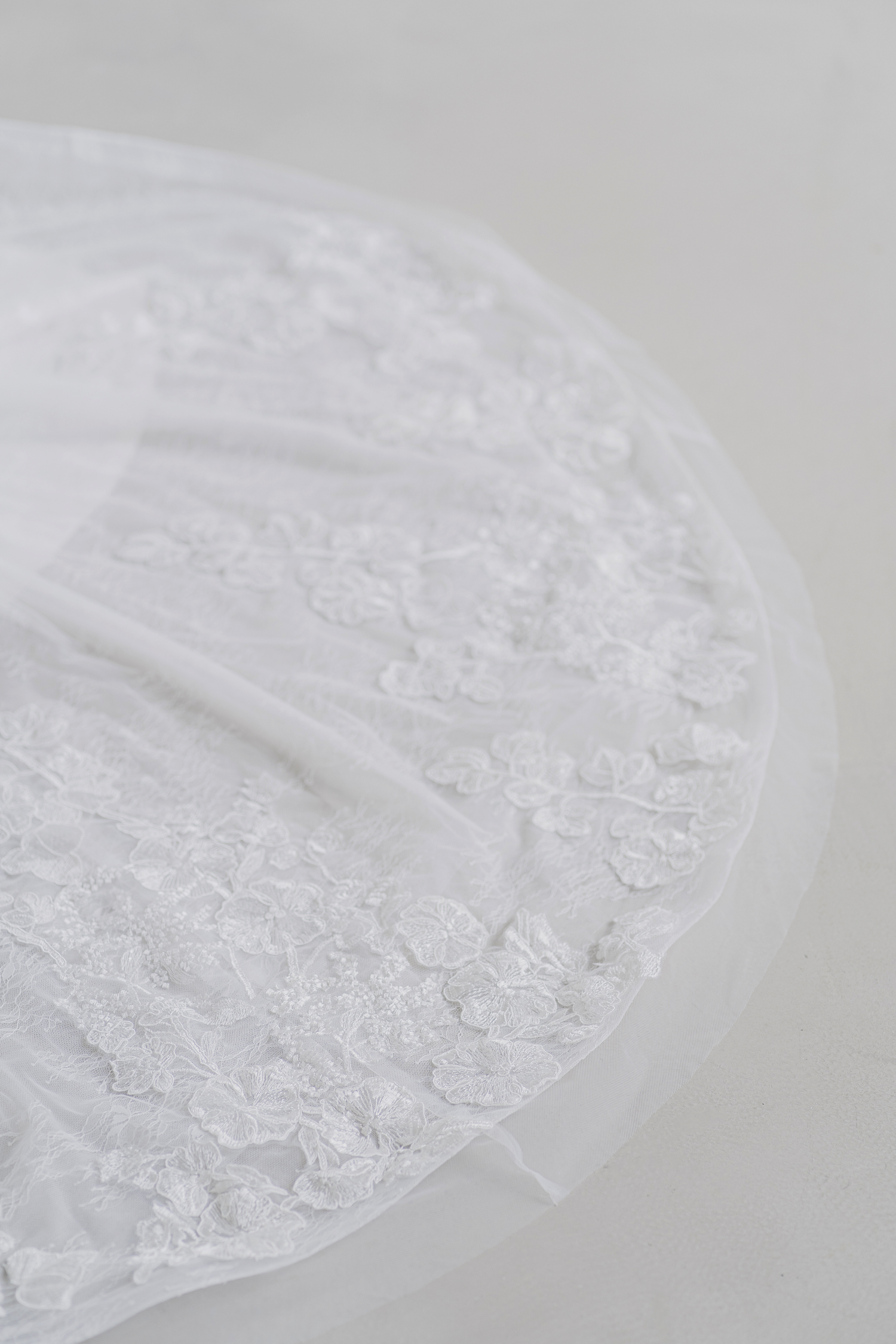 Close-up of Bethany bridal gown with intricate floral lace detailing