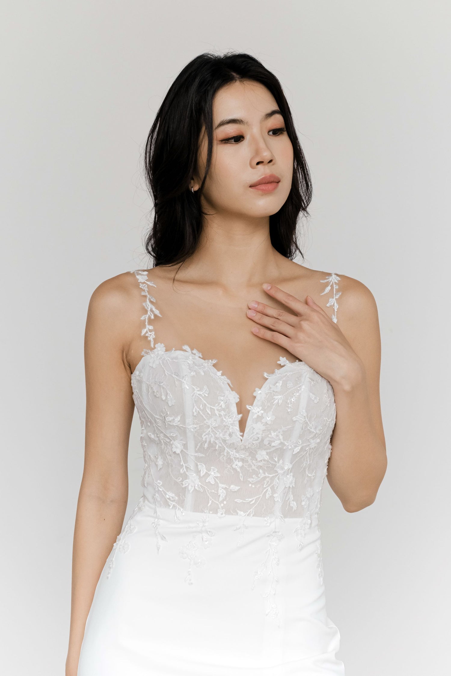 Beverly bridal gown featuring botanical lace straps and a minimalist crepe design