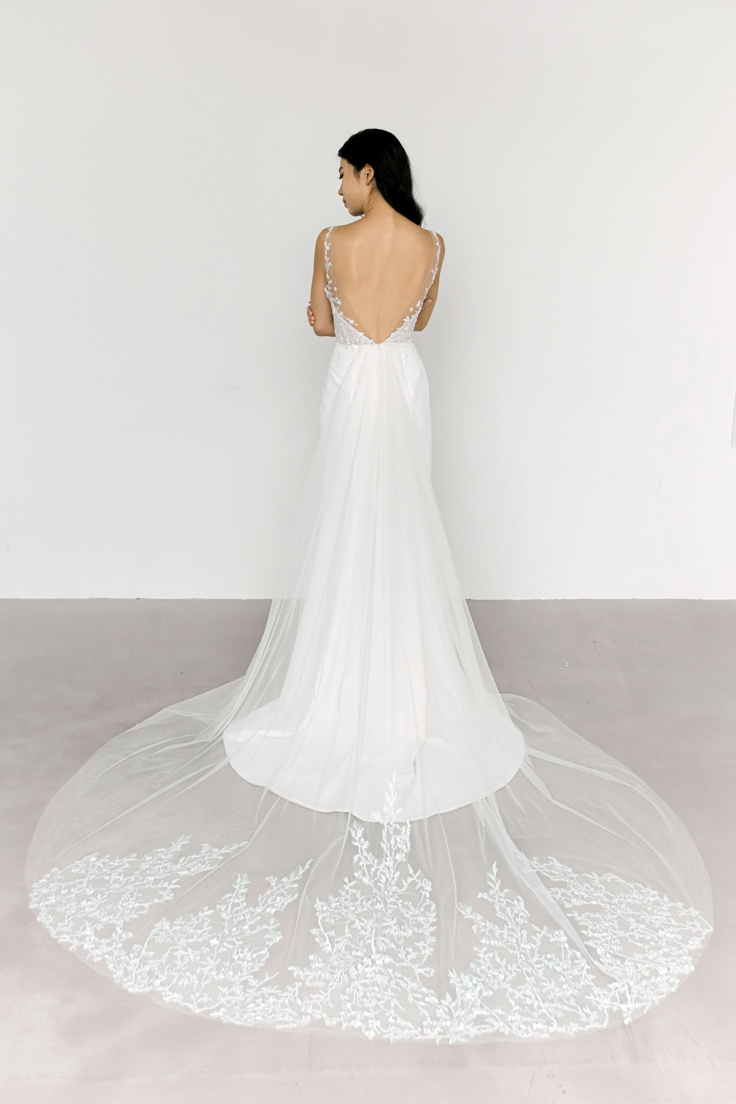 Beverly wedding gown showcasing the dramatic detachable tulle train