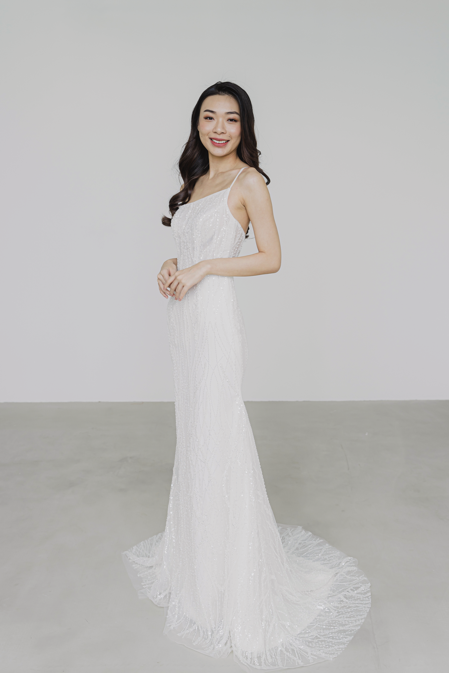 Blake bridal gown featuring shimmering wavy beadwork and a sleek silhouette
