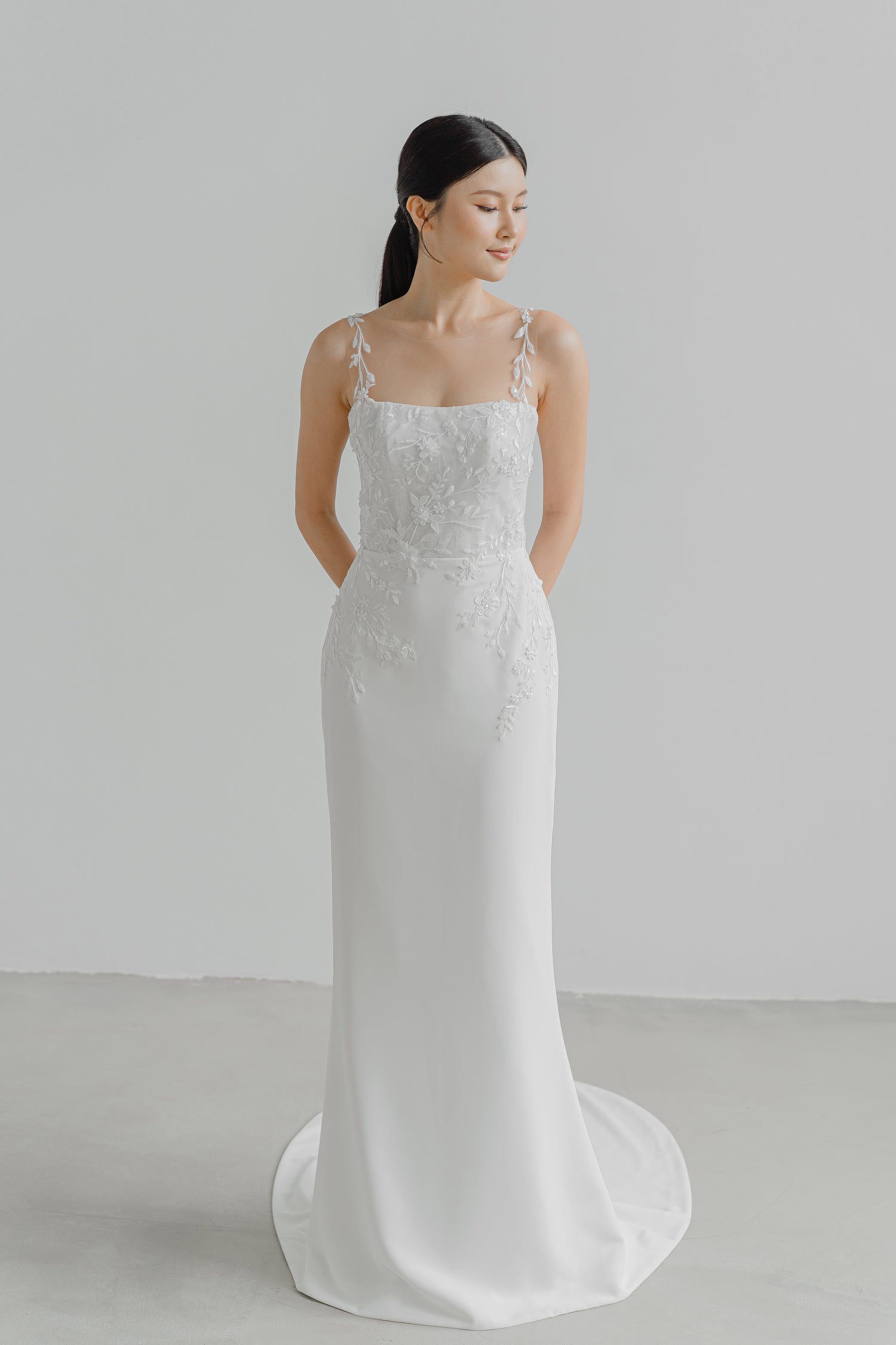 Brianna bridal gown featuring delicate floral lace straps and an elegant fitted silhouette
