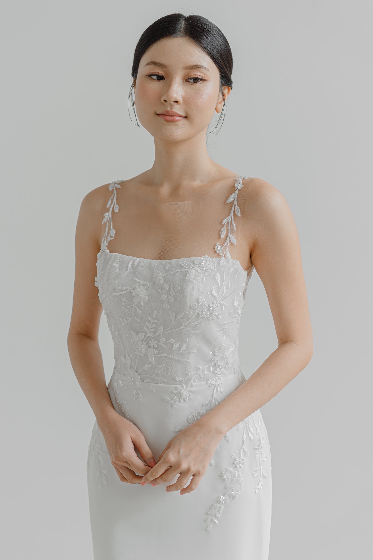 Brianna wedding dress front view with an illusion neckline and relaxed mermaid silhouette