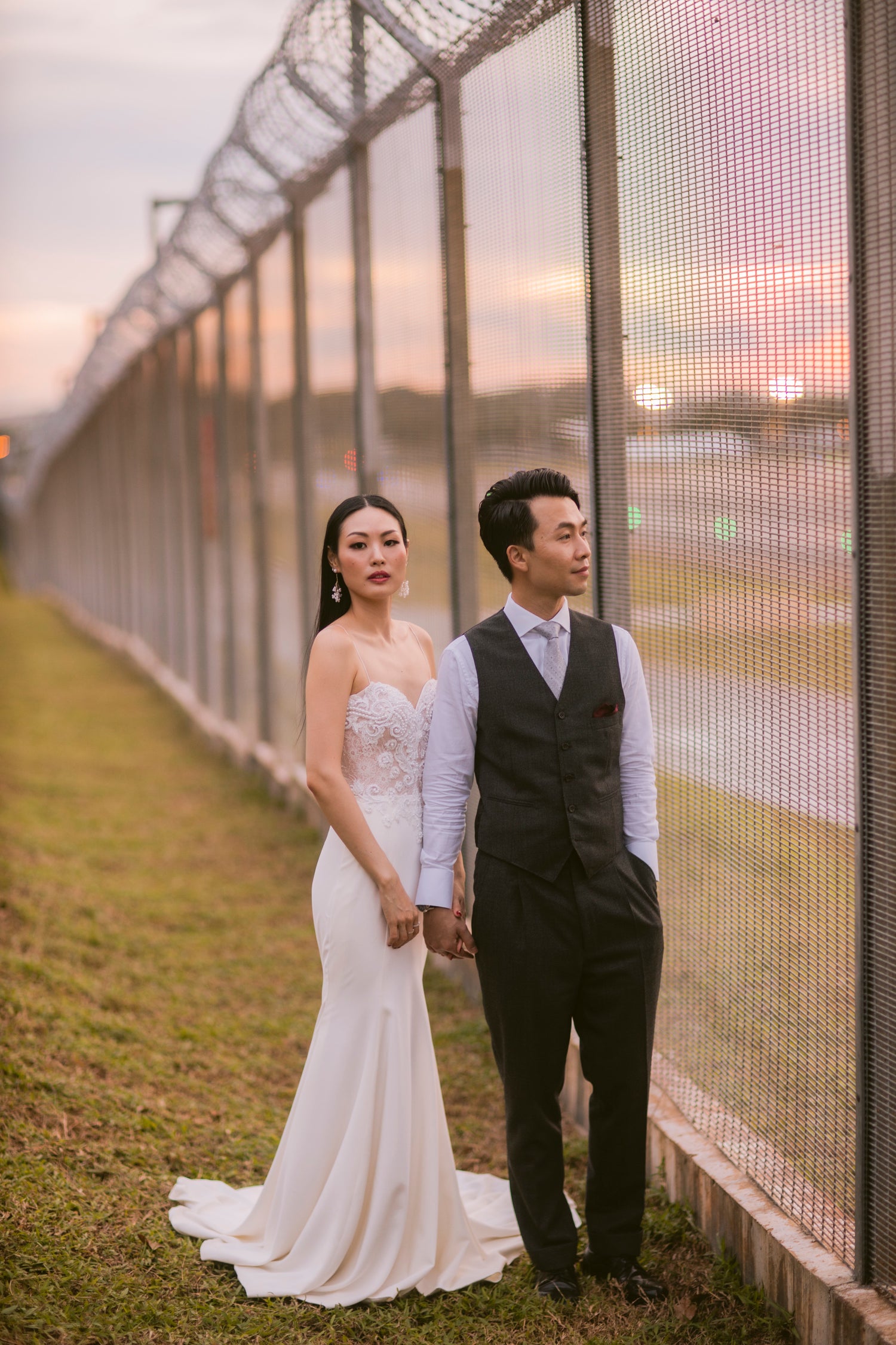 Bride trying on handcrafted WeddingCrafters wedding gowns during a personalised bridal fitting in Singapore.