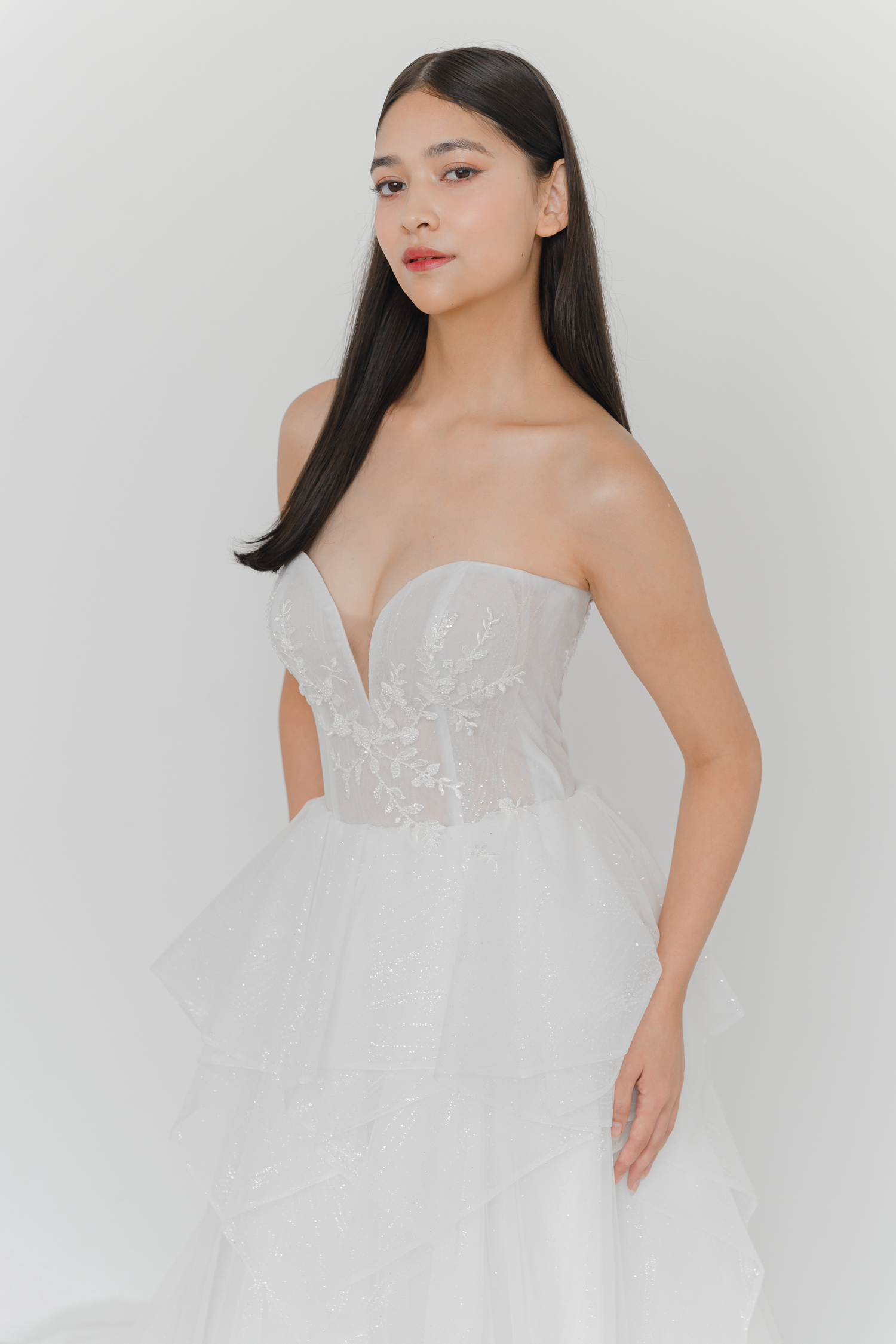 Brielle bridal gown front view with a sweetheart neckline and cascading ruffles