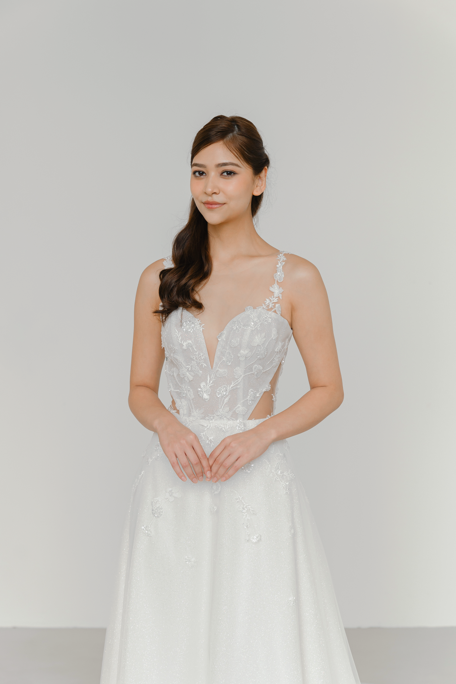 Calsida bridal gown featuring a soft illusion neckline and shimmering glitter tulle