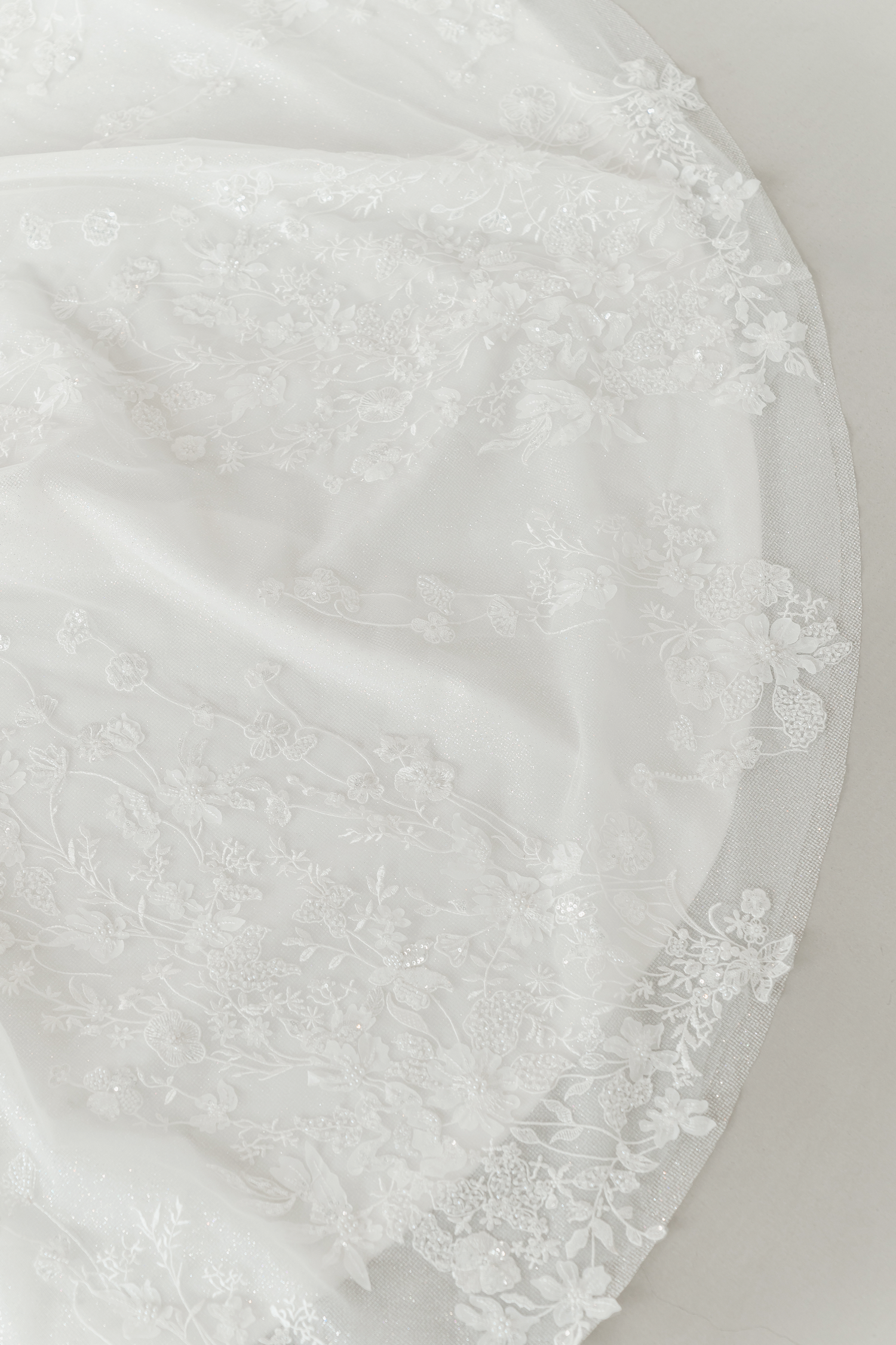 Close-up of Calsida wedding gown highlighting the shimmering glitter tulle fabric