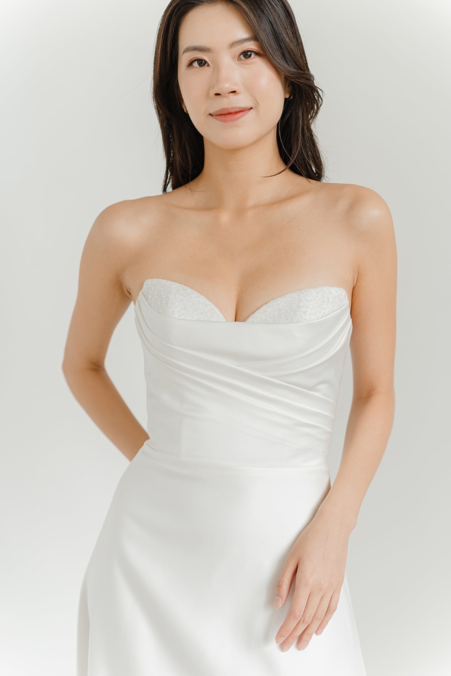 Camila bridal gown featuring a softly draped bodice with delicate beaded detailing