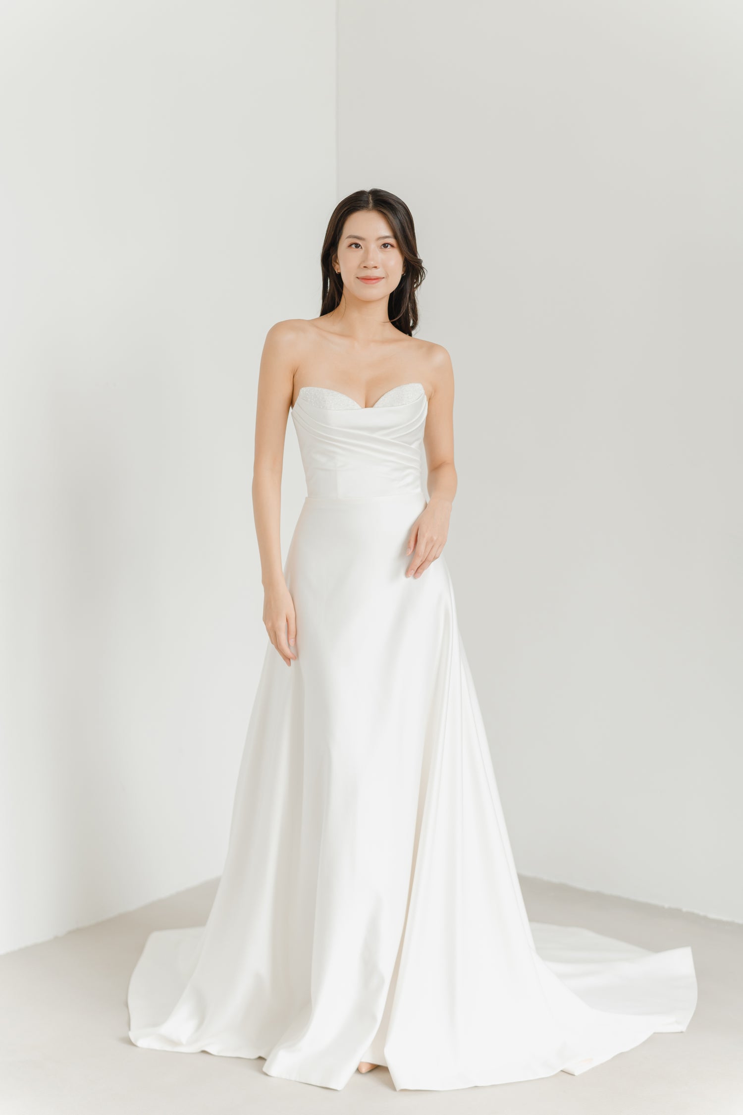 Camila wedding dress front view with a sweetheart neckline and satin A-line silhouette