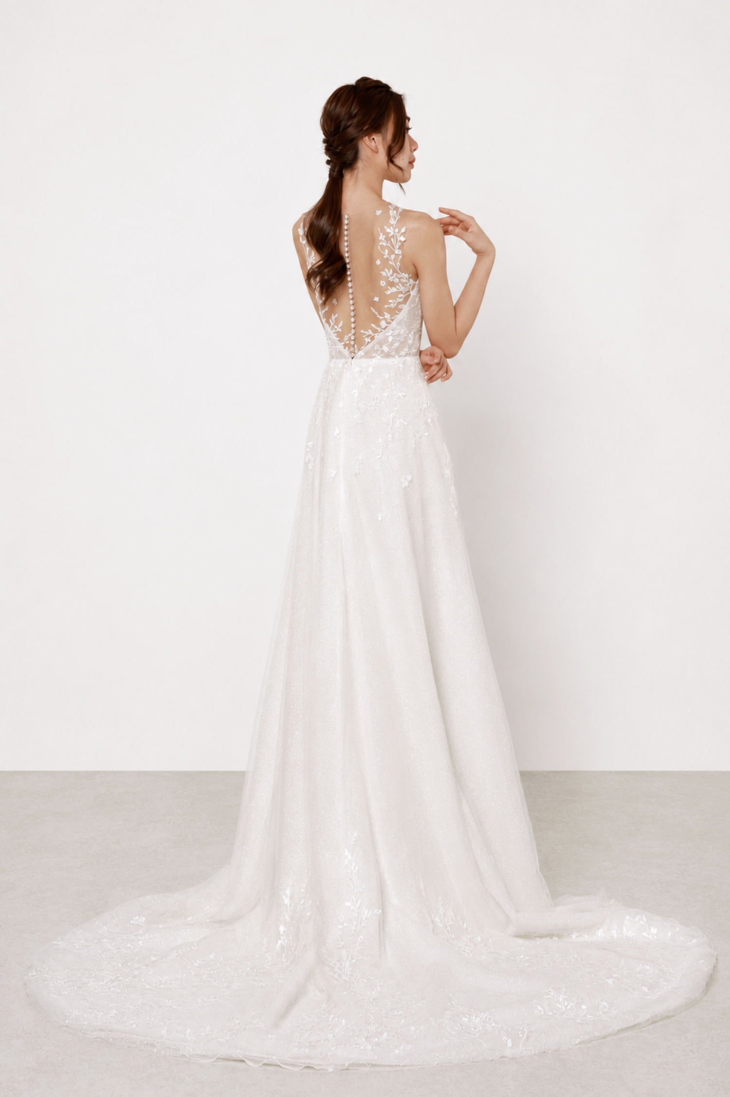 Carina bridal gown train showcasing the glitter tulle base and graceful lace detailing