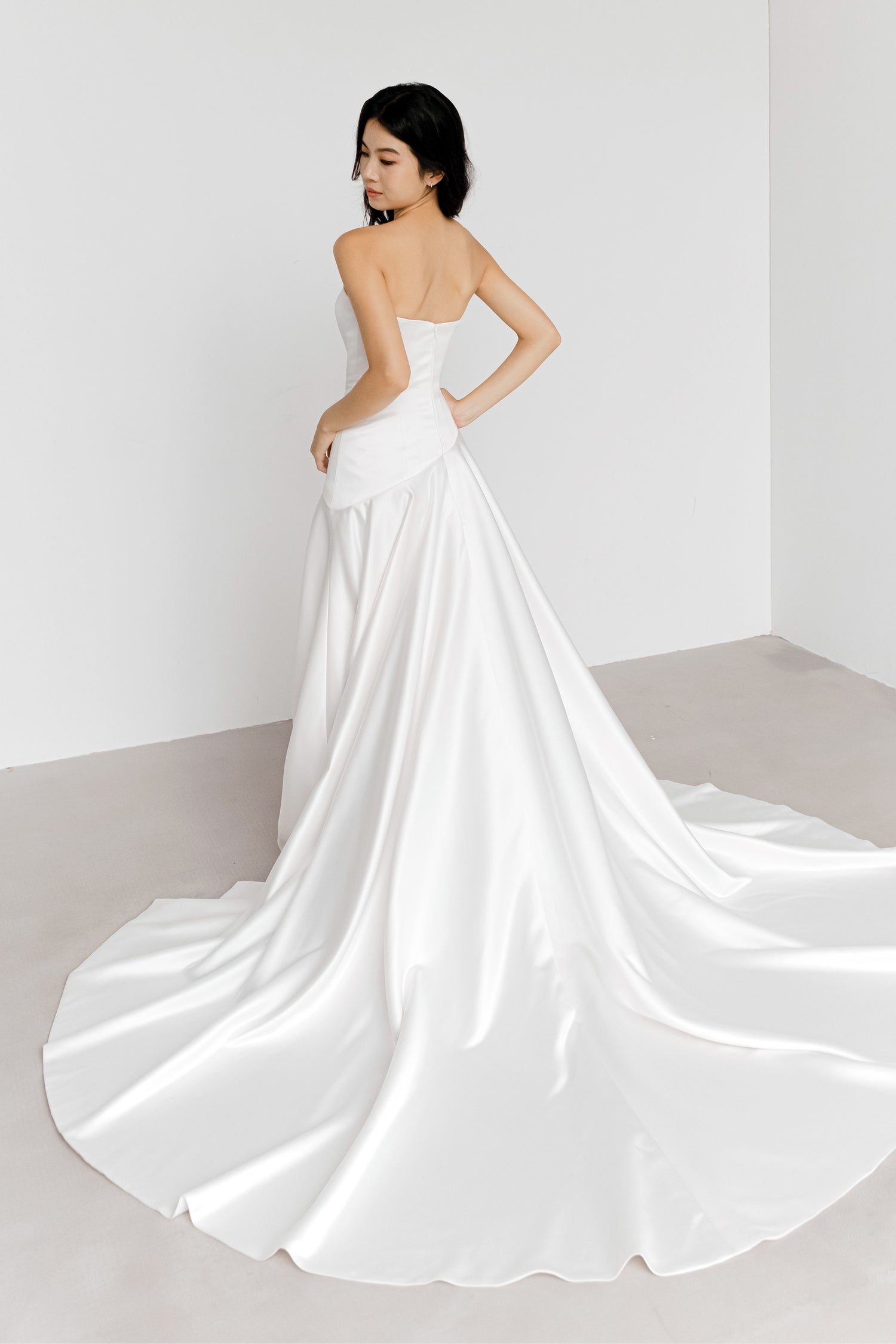 Carmen wedding gown side view showcasing the clean fitted silhouette