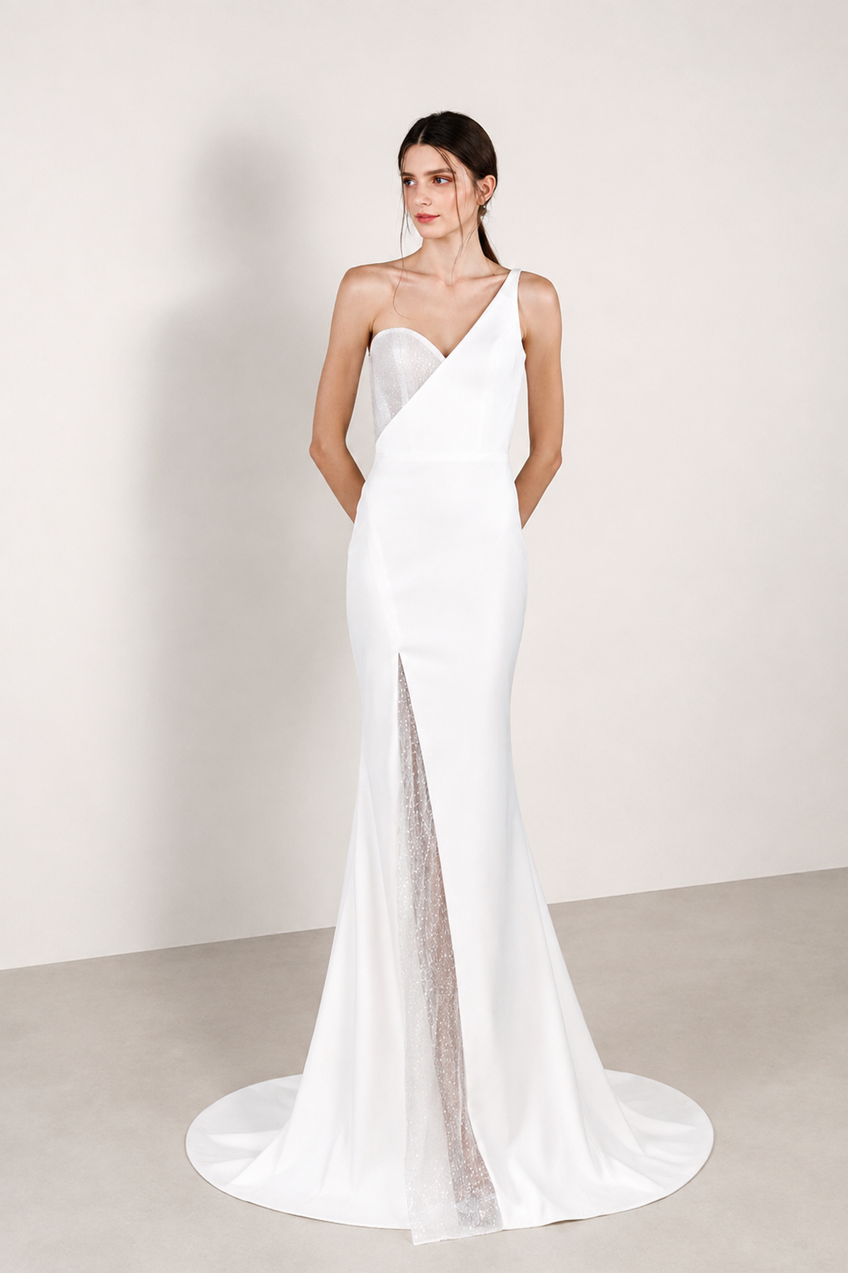 Chelsea wedding dress front view with a modern toga neckline and relaxed mermaid silhouette