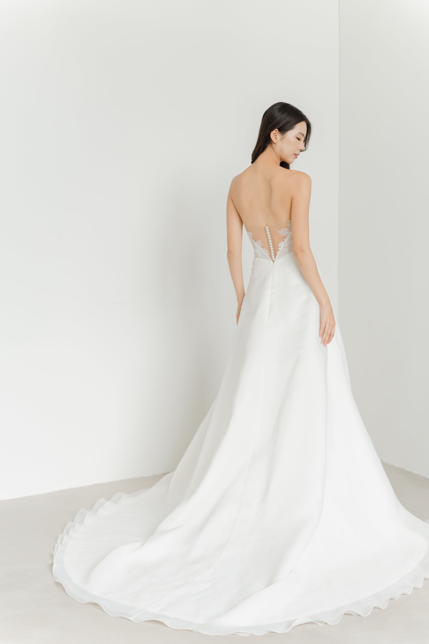 Cherie bridal gown side view with a light flowing organza skirt