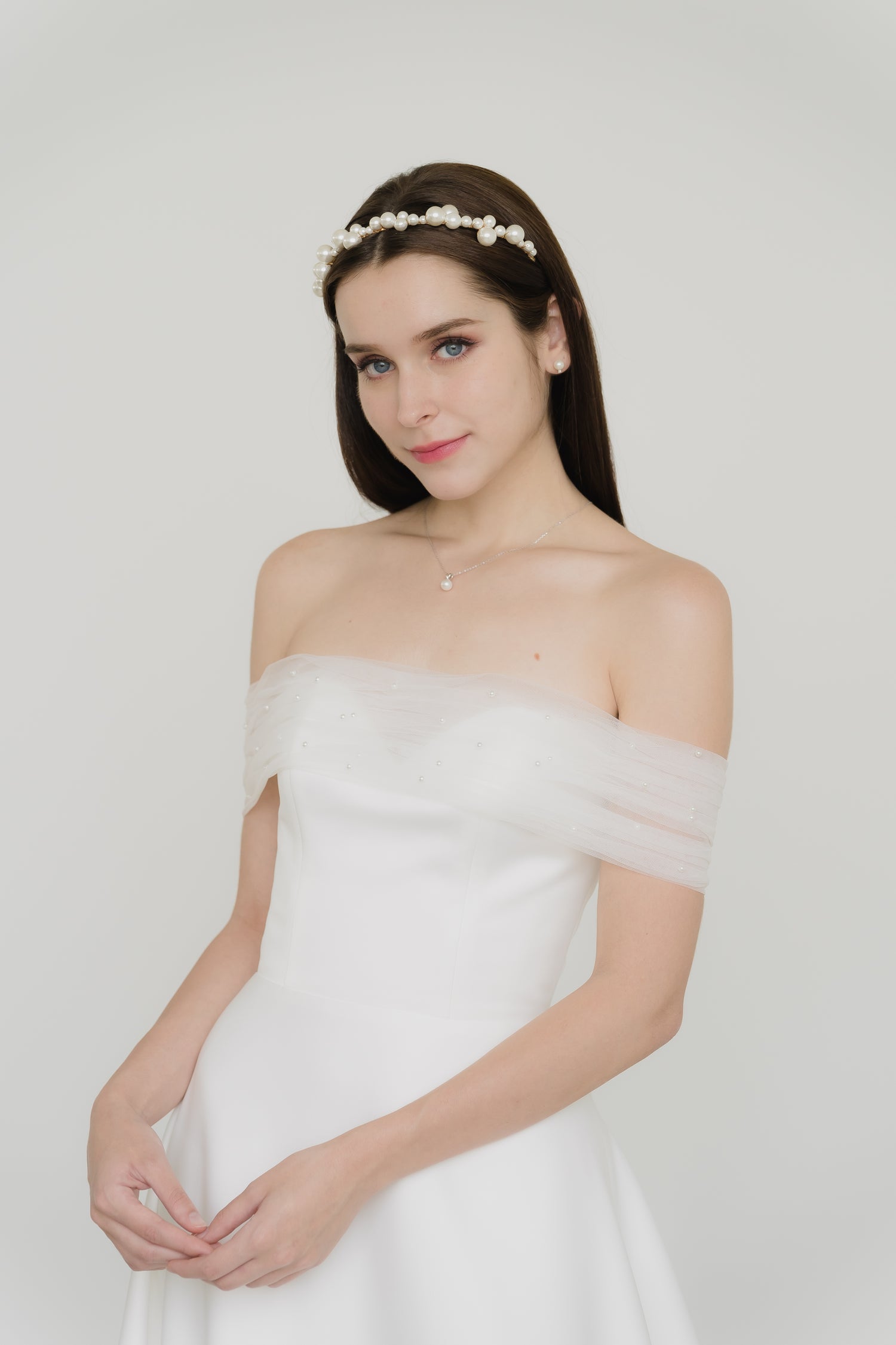 Claire wedding dress front view with a minimalist satin A-line silhouette