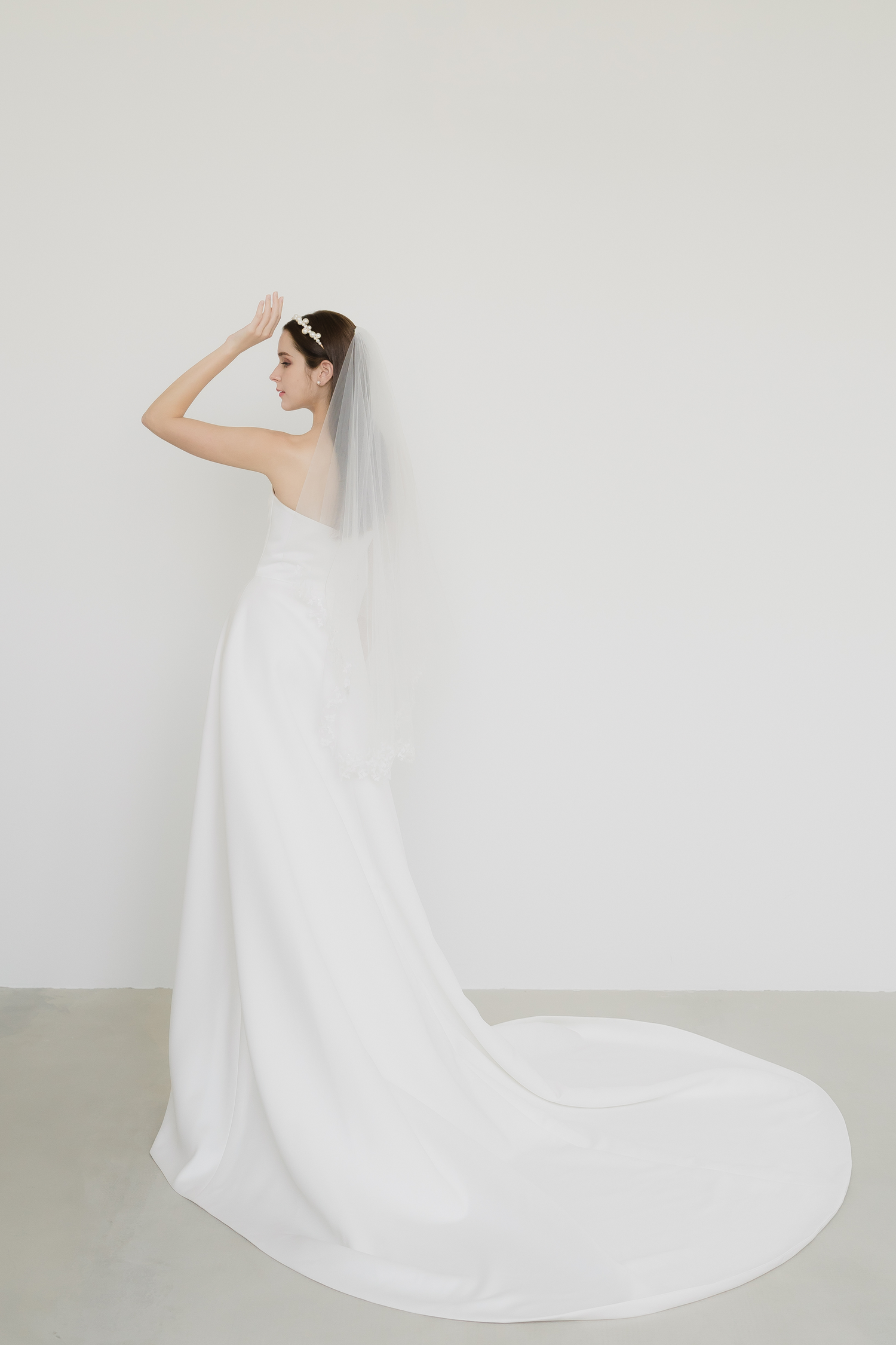 Claire wedding gown train showcasing the elegant satin skirt and flowing train