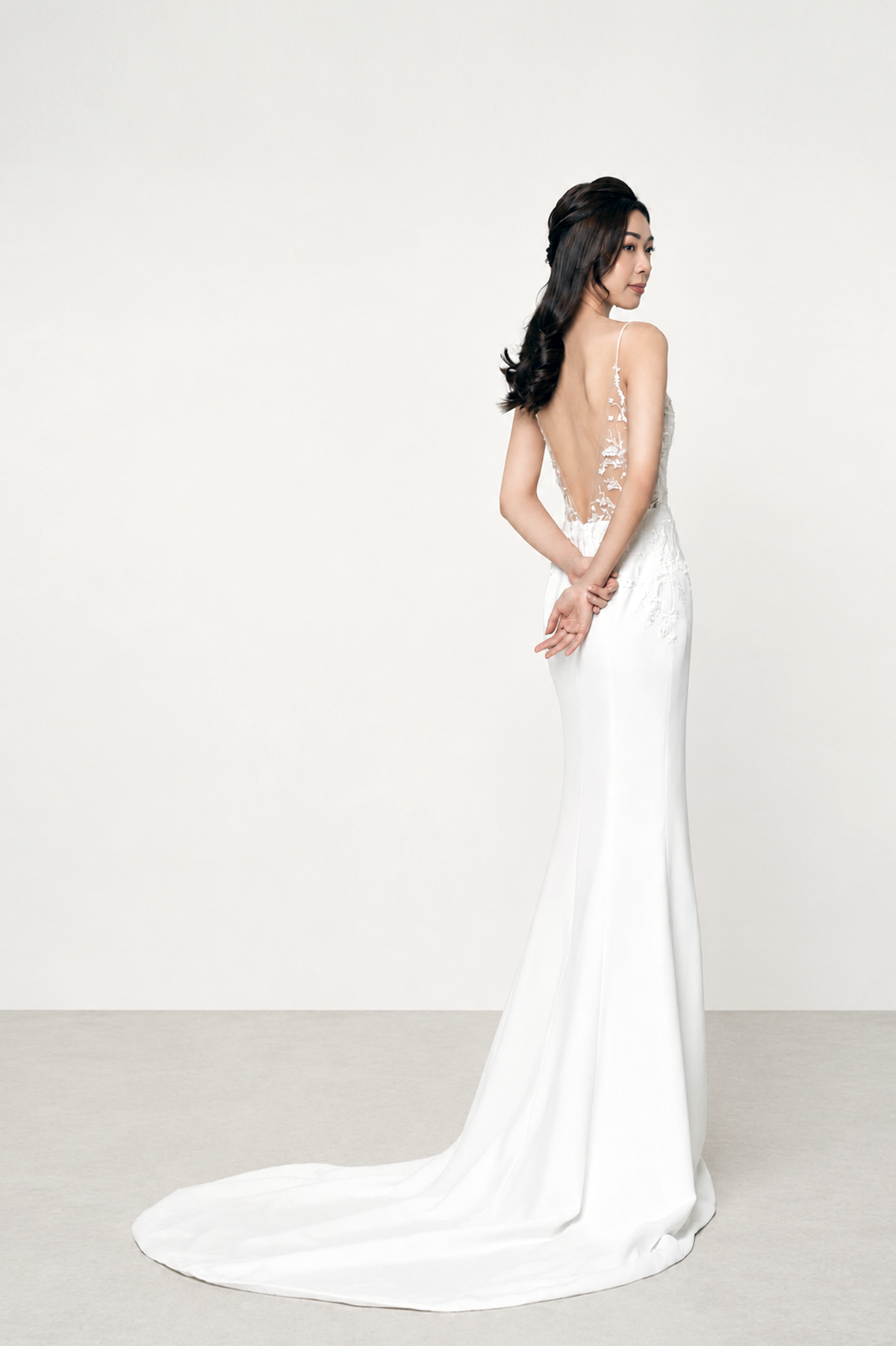 Claudia bridal gown back view with an elegant low illusion V-back