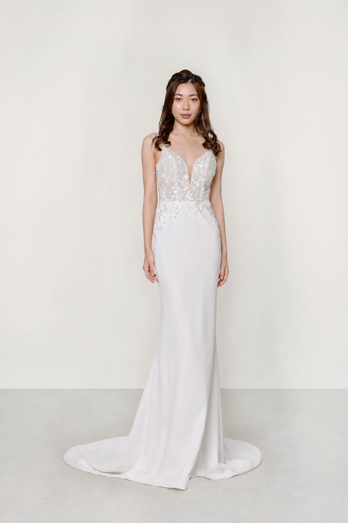 Claudia wedding dress front view with a lace bodice and relaxed mermaid silhouette
