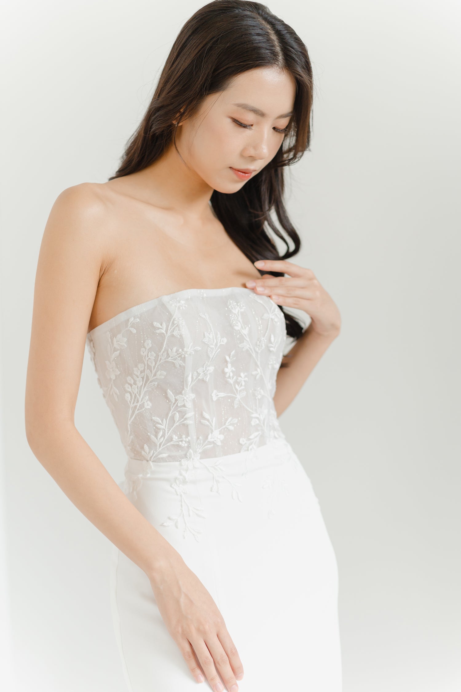 Cleo wedding gown side view showcasing the relaxed mermaid silhouette